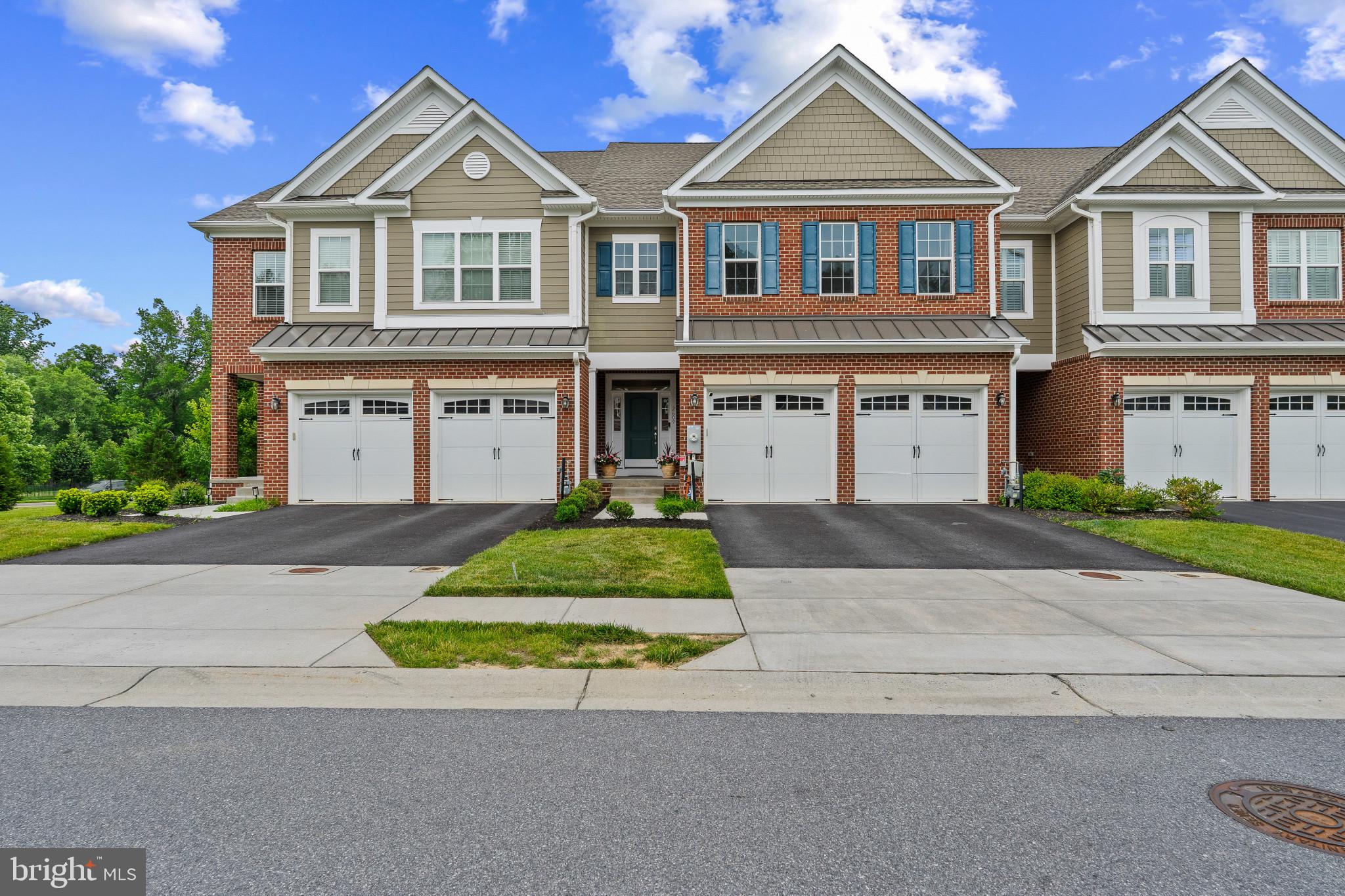 Welcome to luxury living in the highly sought-after Fairways at Turf Valley. This exceptional brick-front townhome offers over 4,500 square feet of beautifully designed living space, perfectly blending elegance, comfort, and convenience. Built in 2019, the home features 4 bedrooms, 3 full baths, 1 half bath, and a desirable open-concept floor plan ideal for both everyday living and entertaining. The gourmet kitchen is the heart of the home, showcasing an oversized center island, granite countertops, premium appliances, a walk-in pantry, and abundant cabinetry. The adjoining family room and dining area create a seamless flow, enhanced by hardwood flooring, 9-foot ceilings, and abundant natural light throughout. Upstairs, the luxurious primary suite offers a spacious walk-in closet and spa-inspired bath, while additional bedrooms provide generous accommodations for family and guests. The finished lower level adds valuable living space with a recreation room, full bath, fourth bedroom, and walkout access. Additional highlights include a two-car garage, Energy Star systems, zoned HVAC, and low-maintenance living. Owned solar panels provide approximately $3,000/year energy savings. Nestled within the prestigious Turf Valley community, residents enjoy golf course surroundings, nearby shopping and dining at Turf Valley Towne Square, top-rated Howard County schools, and easy access to major commuter routes including Routes 40, 70, 29, and 32. This is a rare opportunity to own a spacious luxury home in one of Ellicott City's premier communities.