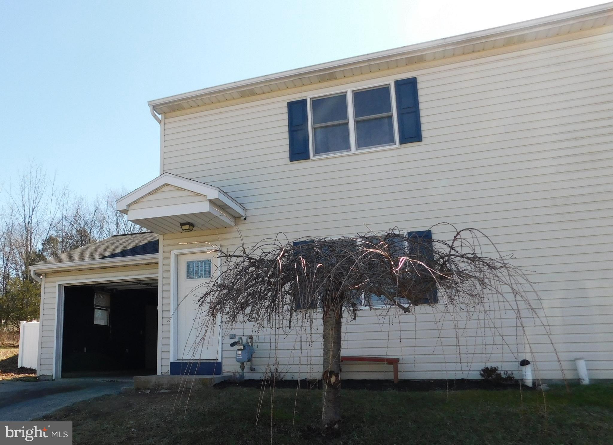 Semi-detached 2 story home with new kitchen flooring and living room carpet.   Newer appliances.   3 BRs, 1 1/2 baths, and a 1 car garage.  Located on a larger lot than most in this development with fencing.  Home needs some TLC on exterior, crawlspace, and attic area.