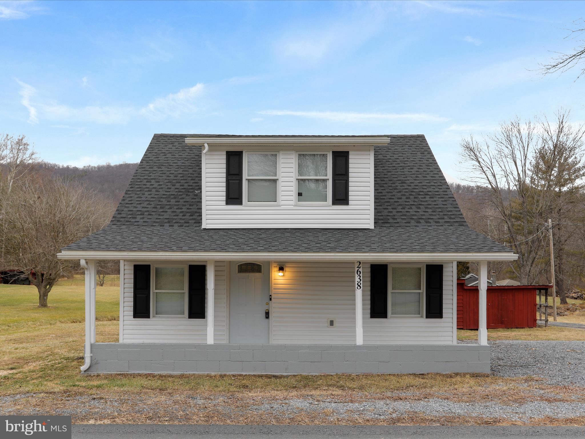 Step into this charming, move-in-ready Cape Cod home, offering 1,078 sqft of beautifully renovated living space. With 2 spacious bedrooms, 1 bathroom, and an additional room upstairs that could be used as a an office or storage space, this home perfectly blends comfort and modern updates. Relax on the peaceful covered front porch, a perfect spot to unwind while enjoying the stunning mountain views.

Situated on a generous 0.36-acre lot, the large backyard is ideal for outdoor activities, complete with a serene small stream. The property also features a large work shed, perfect for storing tools, outdoor equipment, or additional storage. Every inch of this home has been thoughtfully updated with a newer roof, appliances, HVAC system, windows, and flooring—nothing has been overlooked. Additionally, the home offers high-speed fiber optic internet, making it perfect for remote work and streaming!

Conveniently located near the town park, shops, and cozy cafes, this home is just a 35-minute drive to Winchester, VA, and less than 2 hours to Washington, DC. Don’t miss the opportunity to make this beautifully updated home yours—schedule a tour today!