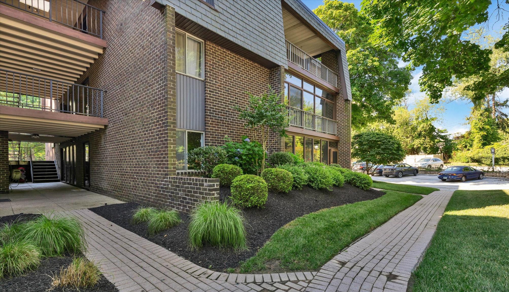 Huge Price Adjustment!! Discover the charm of this beautifully maintained 2-bedroom, 2-bathroom condo in Stevenson Village, that boasts  walk right in access. With 1,210 sq. ft. of inviting living space, this home features an open floor plan that seamlessly connects the living and dining areas, perfect for entertaining or cozy evenings in. The gourmet kitchen is a chef's delight, equipped with stainless steel appliances, wood cabinetry, granite counters, a built-in microwave and self-cleaning oven, along with ample table space, a pantry for all your culinary needs, and large granite island. Natural light pours in through the windows, highlighting the elegant wood floors and recessed lighting throughout. The spacious entry-level bedroom offers convenience, while the primary suite boasts a walk-in closet and a luxurious bathroom with a stall shower for ultimate relaxation. Step outside onto your enclosed patio for year round enjoyment. Enjoy the community amenities, including a sparkling outdoor pool and a welcoming clubhouse. The beautifully landscaped grounds feature secure storage options and well-maintained sidewalks, creating a serene environment for leisurely strolls. Additional features include in-unit washer and dryer, ensuring laundry day is a breeze. With a dedicated parking lot and a range of association services covering maintenance, security, and more, this condo offers a low-maintenance lifestyle without sacrificing comfort. Embrace the opportunity to make this delightful condo your new home!
