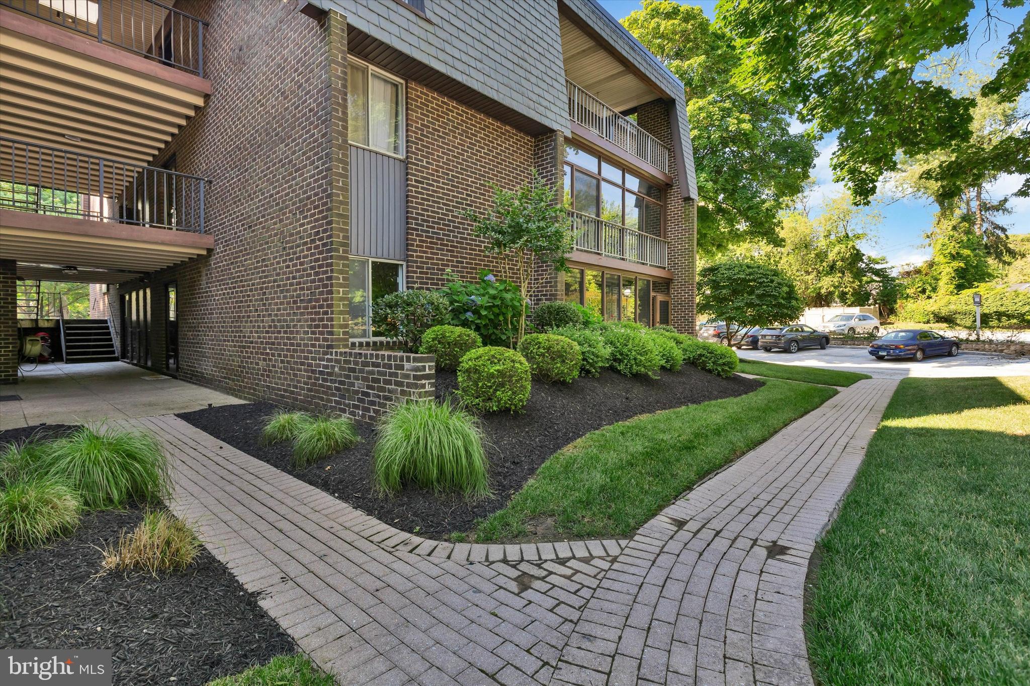 Discover the charm of this beautifully maintained 2-bedroom, 2-bathroom condo in Stevenson Village, that boasts  walk right in access. With 1,210 sq. ft. of inviting living space, this home features an open floor plan that seamlessly connects the living and dining areas, perfect for entertaining or cozy evenings in. The gourmet kitchen is a chef's delight, equipped with stainless steel appliances, wood cabinetry, granite counters, a built-in microwave and self-cleaning oven, along with ample table space, a pantry for all your culinary needs, and large granite island. Natural light pours in through the windows, highlighting the elegant wood floors and recessed lighting throughout. The spacious entry-level bedroom offers convenience, while the primary suite boasts a walk-in closet and a luxurious bathroom with a stall shower for ultimate relaxation. Step outside onto your enclosed patio for year round enjoyment. Enjoy the community amenities, including a sparkling outdoor pool and a welcoming clubhouse. The beautifully landscaped grounds feature secure storage options and well-maintained sidewalks, creating a serene environment for leisurely strolls. Additional features include in-unit washer and dryer, ensuring laundry day is a breeze. With a dedicated parking lot and a range of association services covering maintenance, security, and more, this condo offers a low-maintenance lifestyle without sacrificing comfort. Embrace the opportunity to make this delightful condo your new home!