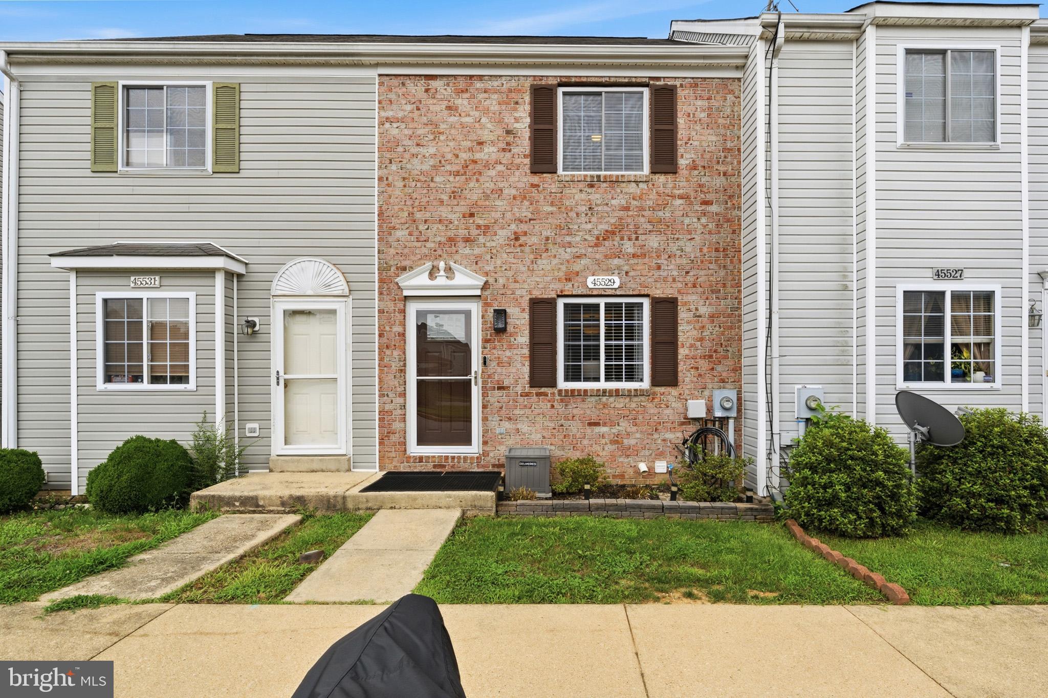 MOVE-IN READY WITH DUAL EN-SUITE BEDROOMS!! Welcome home to this beautifully maintained 2/3-bedroom, 2.5-bath townhouse in the heart of Great Mills, offering stylish updates, spacious living, and a private wooded backdrop. With three finished levels, two en-suite bedrooms, and numerous recent improvements, this home is the perfect blend of comfort, convenience, and value.

Step inside to a bright, open-concept main level featuring new luxury flooring (2025) throughout the living and dining areas. The spacious living room flows seamlessly into the updated kitchen, complete with white cabinetry, stainless steel appliances, a breakfast bar, new kitchen faucet (2025), and new garbage disposal (2026). The dining area opens directly to the rear deck, creating the perfect space for indoor-outdoor entertaining while overlooking peaceful woods. A new dining room light fixture (2026) adds a fresh, modern touch.

Upstairs, you'll find two generously sized bedrooms, each featuring its own private en-suite bathroom, providing exceptional comfort and privacy for family members, guests, or roommates. New blinds throughout the home (2024) and a new ceiling fan in one of the bedroom suites (2025) complete the upper level.

The fully finished walkout lower level offers outstanding flexibility with a spacious recreation room centered around a cozy gas fireplace. Whether you envision a second family room, home gym, office, media room,3rd bedroom or playroom, this versatile space adapts to your lifestyle. Step outside to the fenced backyard and patio, providing additional outdoor living space with room to relax, entertain, or let pets play.

Recent improvements offer peace of mind, including a new furnace (2021), heat pump (2021), hot water heater (2021), HVAC condensate pump (2025), and new deck boards installed in 2024, making this home truly move-in ready.

Conveniently located just minutes from NAS Patuxent River, shopping, restaurants, parks, and schools, this home offers an ideal location for commuters and anyone looking to enjoy everything Southern Maryland has to offer.

Don't miss this opportunity to own a beautifully updated townhouse featuring the highly desirable dual en-suite layout, finished walkout lower level, gas fireplace, and peaceful wooded setting in the heart of Great Mills!