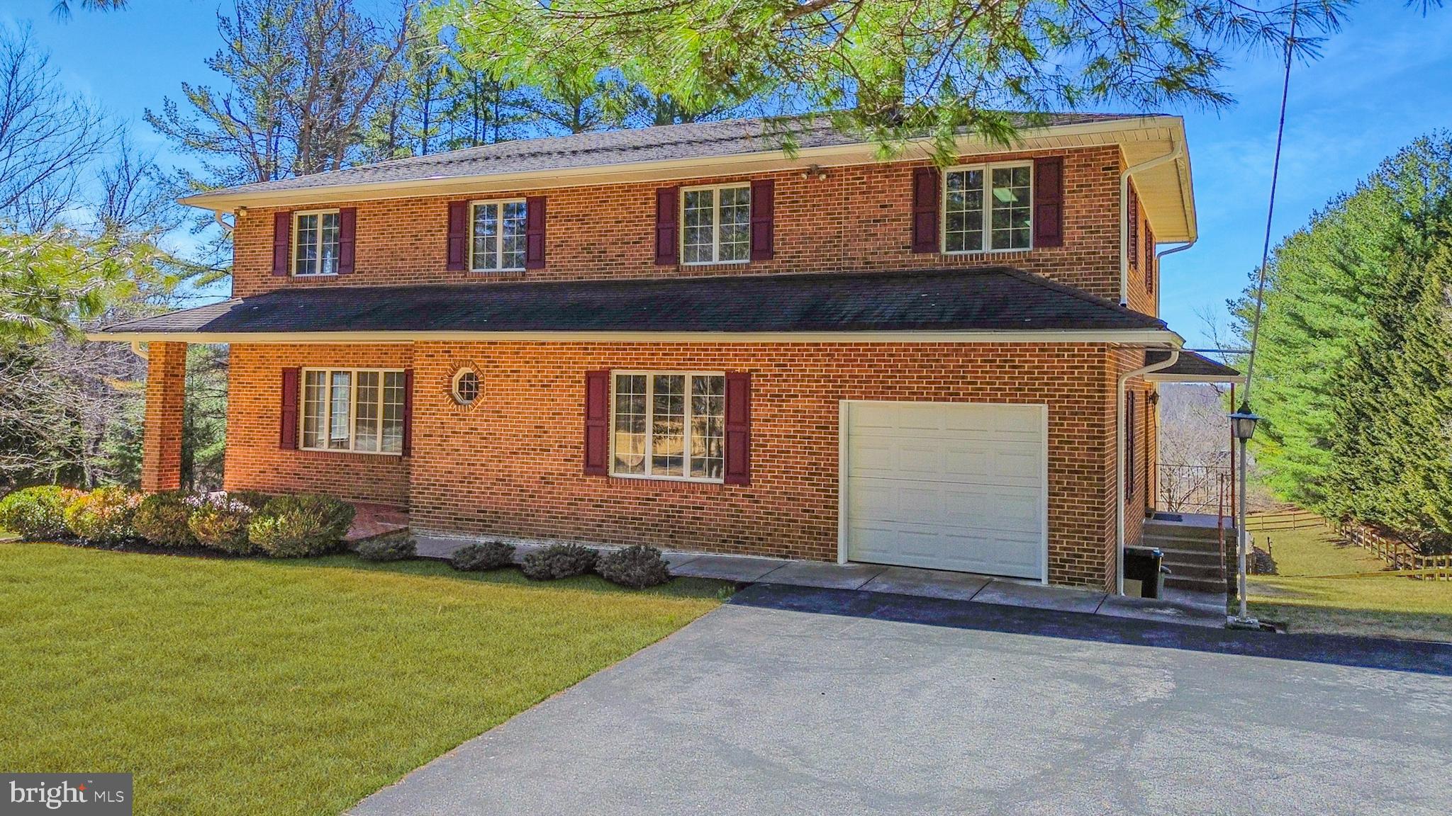 Gorgeous, custom built all brick Colonial with an updated architectural shingle roof, HVAC, hot water heater, perfectly situated on a desirable corner lot with ample parking. The inviting covered brick paver front porch welcomes you into a spacious foyer with 9 foot ceilings that set the tone for the home's timeless character and thoughtful layout. The main level features an oversized formal living room, elegant formal dining room, and an expansive eat in kitchen with pantry and French door access to the screened rear deck, creating the perfect space for everyday living and effortless entertaining.
Just off the kitchen is the charming family room highlighted by a natural fireplace with a striking floor to ceiling brick hearth. The kitchen also provides access to a convenient mudroom featuring laundry, powder room, garage access, and a separate side entrance.
The upper level hosts four incredibly spacious bedrooms, two full bathrooms, and a hall cedar closet, including the primary suite with private bath and a versatile 25x12 bonus room with French doors off the primary bedroom that is ideal for a sitting room, nursery, home office, or flex space.
The lower level offers endless potential, multiple rooms, and awaits your finishing touches, providing abundant space along with walkout access to the rear partially covered patio. An overhead door adds incredible convenience for storing lawn equipment, tools, or recreational items.
Beautifully positioned on a corner lot with generous parking and plenty of outdoor space, this exceptional home offers comfort, charm, and endless possibilities in an ideal, sought after location.
Convenient to Liberty Reservoir, fishing, hiking, along with many more outdoor activities.