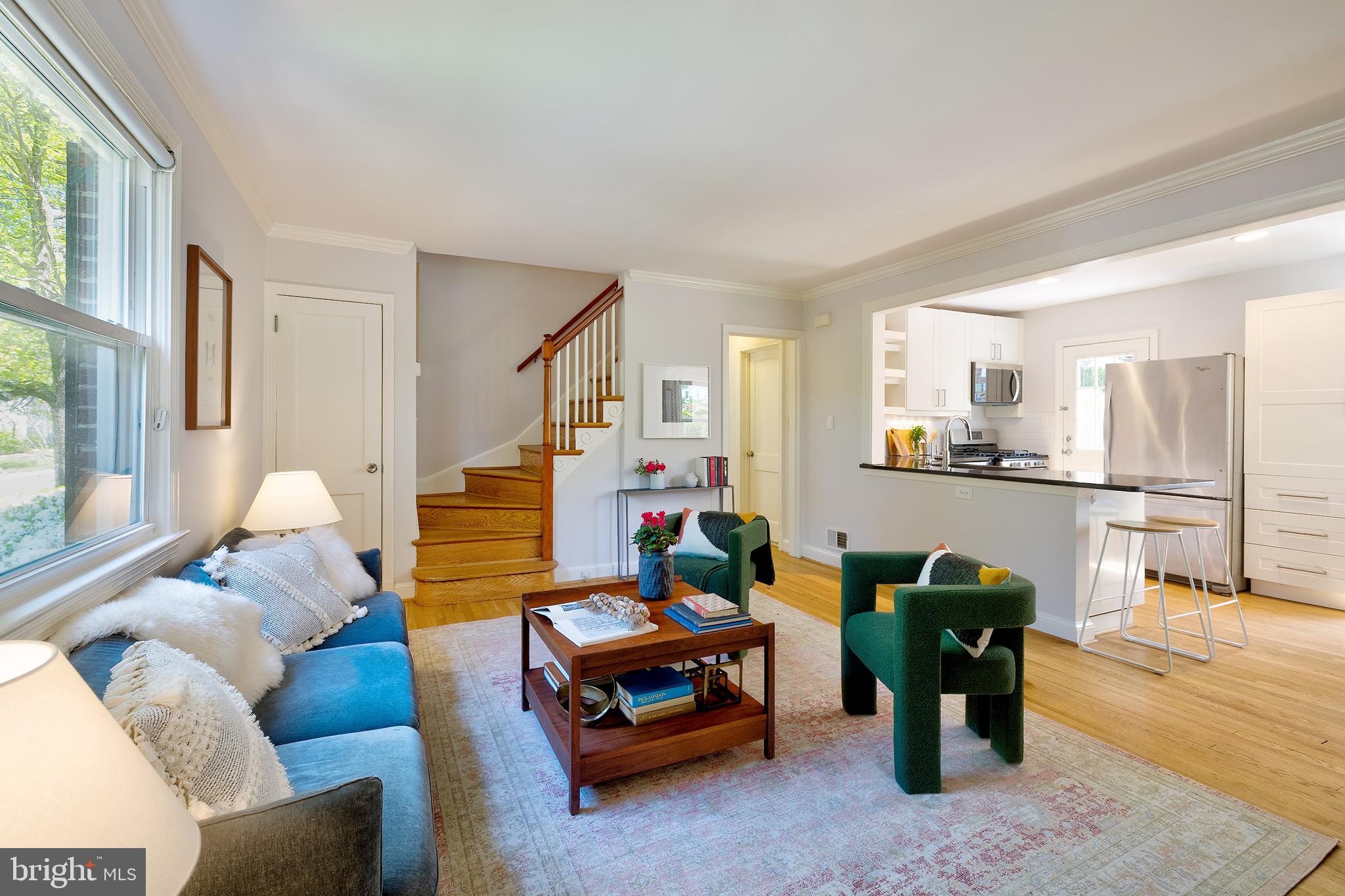 Charming and updated 4BR Cape Cod with a large yard on a prime corner lot in the sought-after neighborhood of Forest Estates! Enter through the enclosed front porch to find the bright and open main living space which features hardwood floors throughout, a large living room with wood-burning fireplace, a beautifully updated kitchen with stainless steel appliances and peninsula breakfast bar, and a dining area with custom built-in banquette seating. The main level also offers two bedrooms and a full bathroom with tub/shower combo. The second level features two additional bedrooms - including the stunning primary bedroom with multiple desk or reading nooks - and the updated second bathroom. The basement provides an  extra rec room, laundry, and plenty of storage space. Outside you can enjoy the back deck, the large yard, beautifully landscaped gardens and flower beds, and parking for 1+ in the driveway.  All located on a wonderful corner lot in beloved Forest Estates - a community that is convenient to the Forest Glen Metro, neighborhood parks, hiking and biking along Sligo Creek, golf and tennis, all of the shopping and restaurants in Woodside and downtown Silver Spring just a short drive away, and the excitement of DC just a few minutes beyond that. Welcome home!