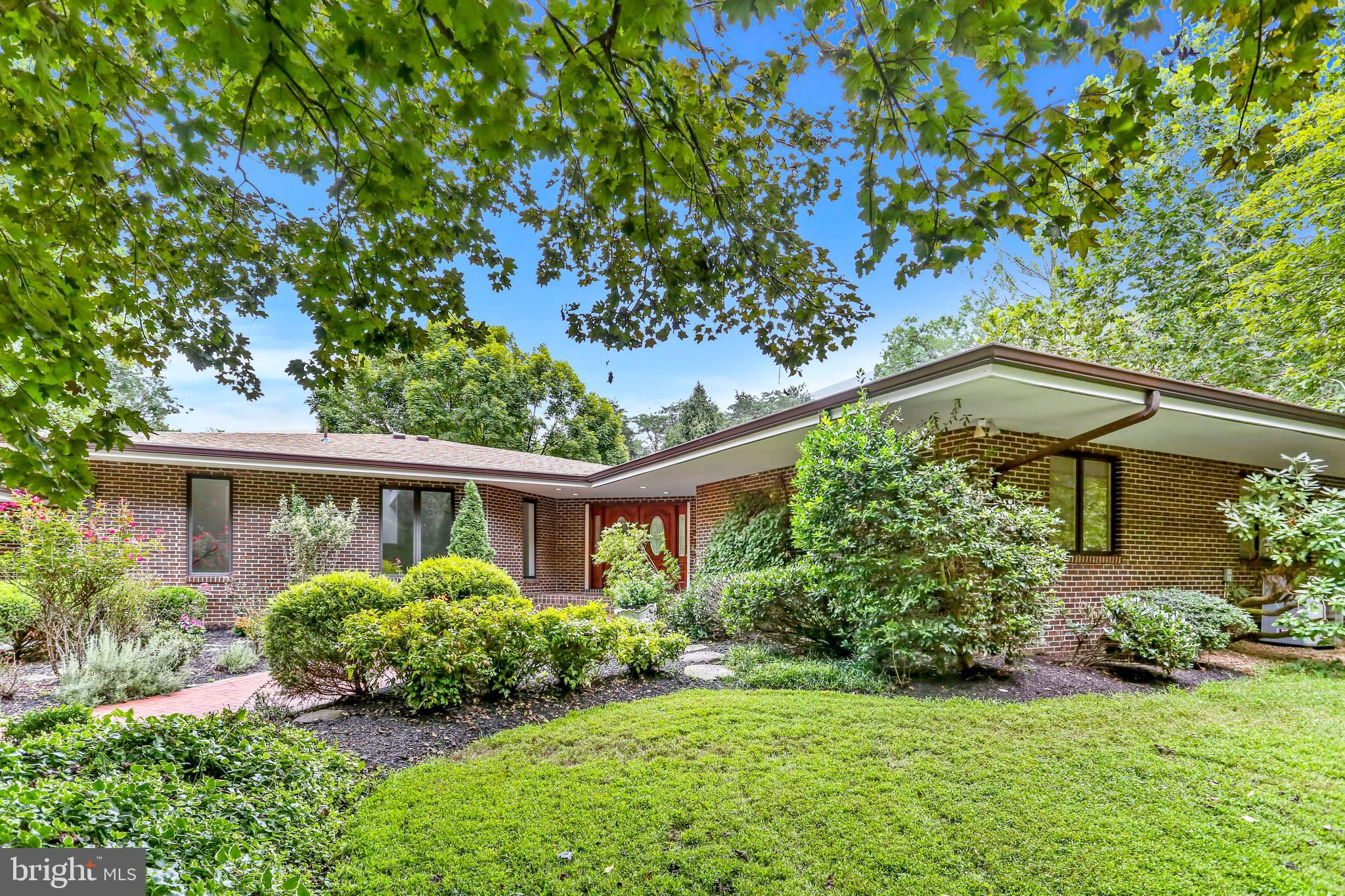 Exquisite Tuscan-Mid Century Ranch on 6 Private Acres – A Rare Luxury Rental in Vienna
Experience unparalleled luxury and privacy in this meticulously designed Tuscan-Mid Century Ranch, a true architectural masterpiece nestled on six serene acres in Vienna. Constructed entirely of brick and designed to embrace natural light, open spaces, and effortless flow, this V-shaped estate is the perfect blend of timeless sophistication and modern comfort.

Approached by a long, tree-lined driveway, this home immediately captivates with its tranquil setting and breathtaking views. The double front doors open to a grand entryway framed by glass doors, offering a stunning first impression with views of the pool and rolling pastures beyond.

An Entertainer’s Dream & A Private Retreat
Every detail of this home has been thoughtfully curated to provide the ultimate indoor-outdoor lifestyle. The sunken living room, wrapped in walls of glass, seamlessly merges with the surrounding landscape, creating a serene, light-filled space perfect for relaxation or entertaining.

The gourmet kitchen is both functional and striking, featuring cherry cabinetry, granite countertops, an oversized walk-in pantry, and a cozy breakfast nook with sliding glass doors leading to an expansive wraparound deck. Here, mature trees provide a lush, private backdrop for morning coffee or evening gatherings.

The formal dining room is spacious and elegant, ideal for hosting memorable dinner parties, while the sun-drenched family room with a fireplace adds warmth and comfort. A private library/office, also with a fireplace, provides the perfect space for work or quiet reading.

A custom wet bar and laundry room complete the main level’s thoughtful design.

Exceptional Living Spaces
On one side of the home, the luxurious primary suite is a true retreat, wrapped in windows to bring in stunning natural light. A floor-to-ceiling stacked stone fireplace creates an inviting ambiance, while large closets and a spa-inspired ensuite bathroom offer a five-star experience.

Two additional spacious bedrooms and a beautifully designed full bathroom complete this wing, ensuring comfort and privacy for family or guests.

A Lower Level Full of Possibilities
The walkout lower level is an unexpected delight, offering additional space for entertaining, wellness, and relaxation. This level features:
✔ A large family/media room for movie nights or casual lounging
✔ A wine cellar for collectors or those who love to entertain
✔ An exercise room to maintain a healthy lifestyle
✔ A private 5th bedroom with an ensuite bathroom, perfect for guests, an au pair, or an in-law suite

There is an optional 5 stall barn for use as well.

A Rare Find: Middleburg Serenity in the Heart of Vienna
This home offers the peaceful ambiance of Middleburg, yet it is just minutes from Vienna and Reston's top-rated restaurants, shopping, and major commuting routes. Whether you seek a luxurious escape, a space for elegant entertaining, or a refined retreat, this residence is truly one of a kind.

Opportunities like this are rare—schedule your private tour today!

Appointment required.  Reach out to Listing Agent for Private Tour