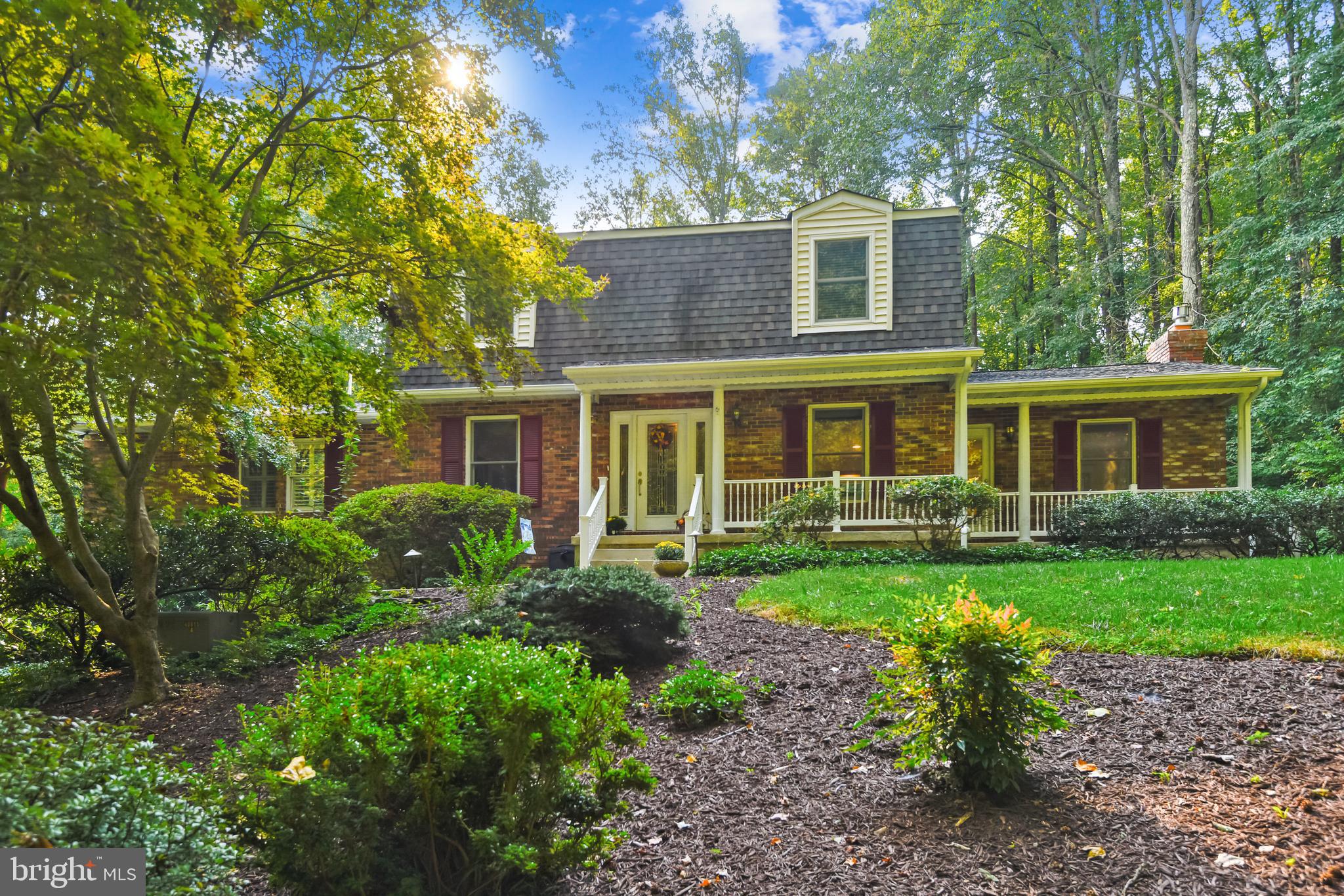 This 4 bedroom, 4 full bath dutch colonial in Crownsville is a hidden gem and a must see!  Located in Baldwin Hills South, 1298 Dorothy Road is tucked back at the end of the cul-de-sac, hidden from view from the road.  Your own oasis of privacy, it sits on almost 3 acres of land.  The open floor plan on the main level allows an easy flow from the living room and kitchen to the dining room.   The kitchen includes stainless steel appliances, granite countertops, and both recessed and pendant lighting.  The living room includes a stacked stone, gas fireplace, and opens into a spacious sun porch.  The main level primary suite is just off the dining room, with dual sinks, jacuzzi tub, walk in closet, and slider access to the deck.  The upper level offers a second primary suite, plus two bedrooms and an additional full bath.  The finished basement level includes a family room, full bath, two finished bonus / storage rooms, and the two car garage.  The attached deck offers over 1,200 square feet of entertaining space that looks out into the woods.  An additional detached deck offers over 500 square feet of space, designed to make an above-ground pool feel like an in-ground.  Outside the living room is the koi pond, with two waterfalls built into the side hill.  The entire property is extensively landscaped, for beautiful views of nature from every angle.  Just a couple blocks from the Baldwin Hills swim club, and a few minutes drive from all the shopping of Waugh Chapel and Crofton.  Easy commute to Washington DC, Annapolis, and Baltimore.  See it today!