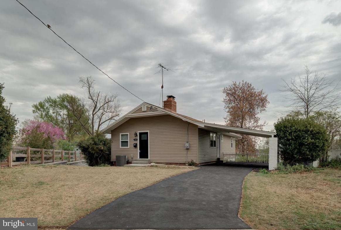 This beautiful turnkey home has been fully renovated! Big-ticket items have been upgraded like new floors, new siding, new windows, new appliances, new washer/dryer, new interior & exterior doors, new quartz countertops with new 42" cabinets & backsplash, new wet bar in basement with quartz countertops, new gutters & downspouts, new electric fireplace, new beautiful mirrored closet doors, fresh paint, new light fixtures, and more. 

The property has a large backyard that is almost fully fenced in and an awesome carport partially above driveway. There are 3 main level bedrooms with 1 full bath and 1 half bath. All bathrooms have also been fully renovated. Basement includes 2 bedrooms and 1 full bath with a beautiful wet bar and plenty of living space. There is a side entrance for easy basement access.
