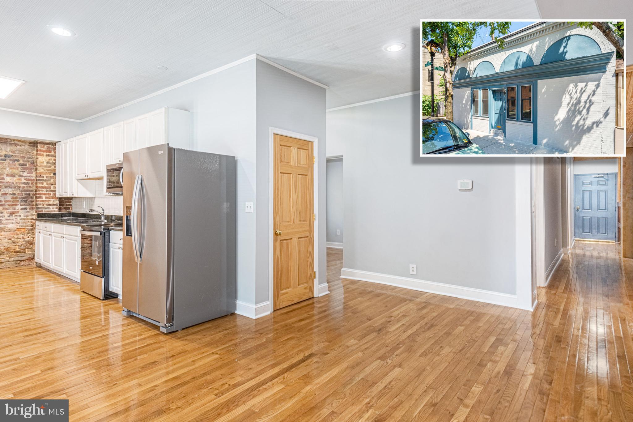 TRULY UNIQUE FELLS POINT HOME WITH TONS OF CHARACTER & CHARM AND DESIRABLE GARAGE PARKING!  This is not your typical Fells Point home - single level living with over 1,400 sq ft of living space featuring hardwood floors, and exposed brick throughout, Chef's kitchen with granite counters & ss appliances, 2 generously sized bedrooms and 1 full bath, attached garage AND additional off street parking!  Located steps from Fells Point restaurants and waterfront!