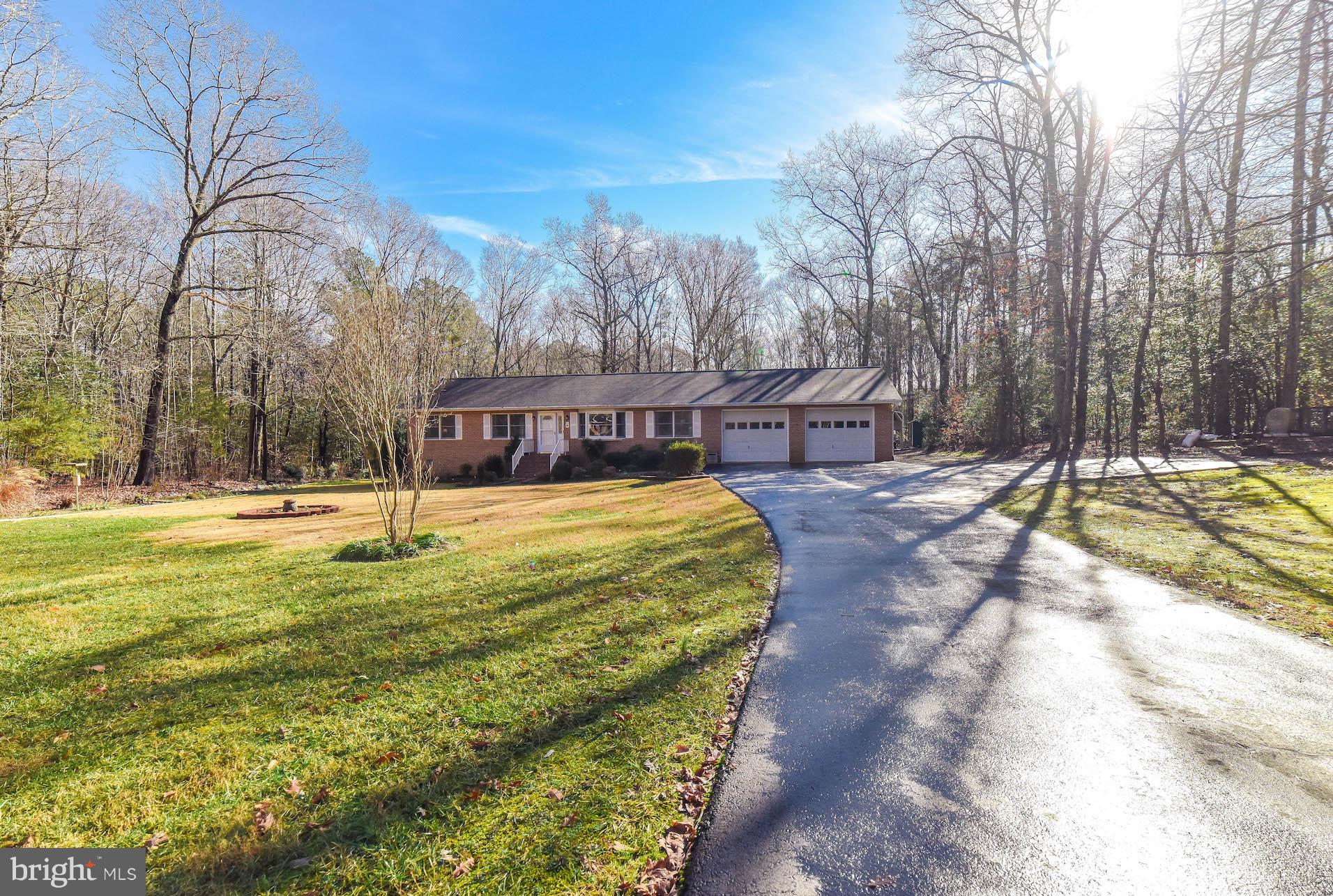 All brick rambler sitting on 5.37 acres surrounded by nature. Meticulously maintained and manicured inside & out. Hardwood floors in main living areas, perfect KT with solid wood cabinets, and solid surface counters FR/DR, with pellet stove insert for those chilly winter nights. Three generously sized BRS and two BTHS  Formal LR and DR. Oversized two car garage, two sheds plus newboat/carport, new three season room overlooking all that nature has to offer, plus a very large private back yard w/ lots of wildlife.