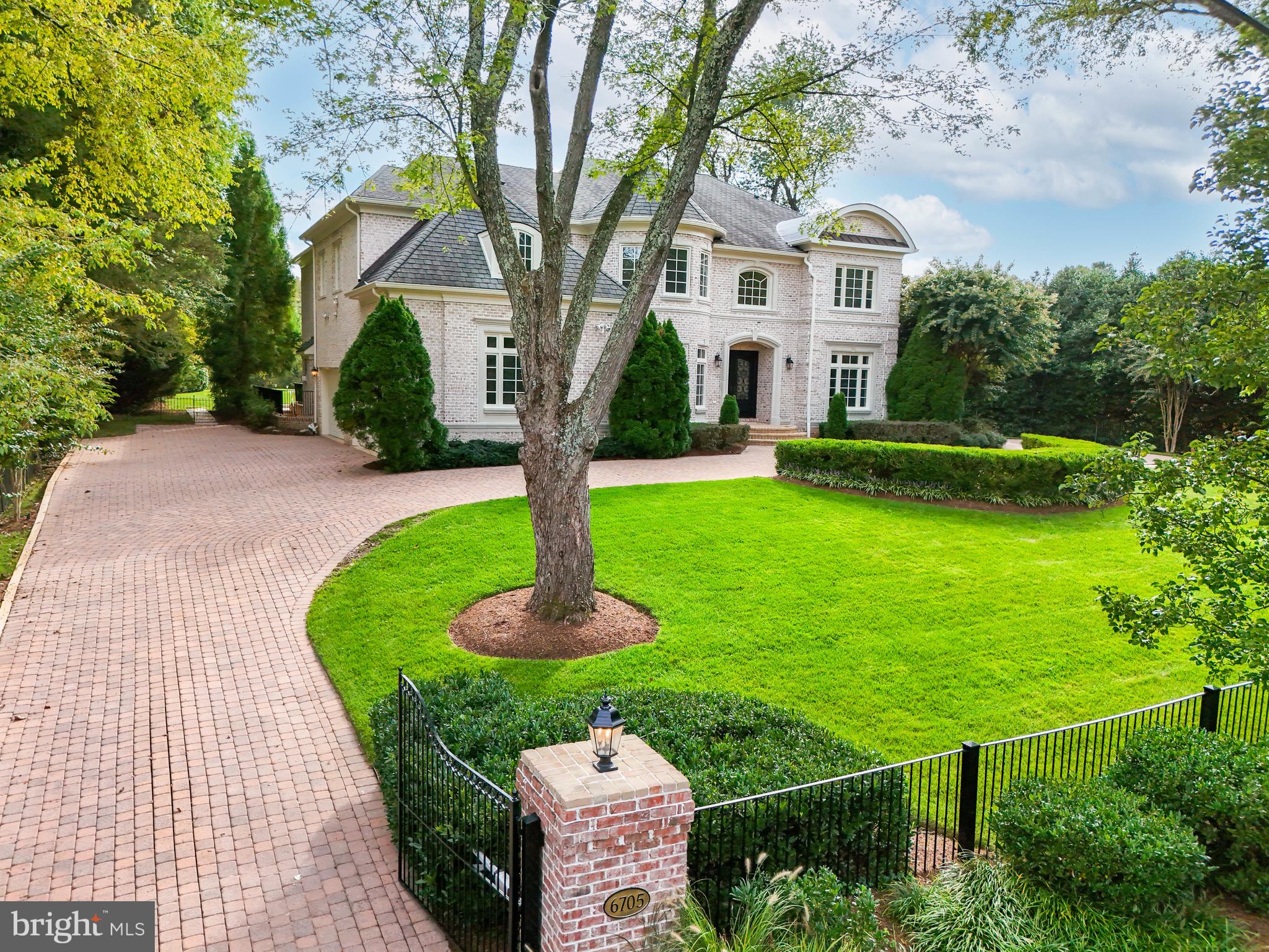 Exquisite Custom Estate in Langley Forest with the most Magnificent Backyard in the neighborhood!
This breathtaking estate on 1.15 acres with meticulous landscaping has a stunning pool area and unparalleled vistas. The fully fenced property is accessed by a gracious circular driveway, leading to a 4-car Garage and inviting terraces.
Upon entering the elegant two-story Foyer, you’ll be captivated by soaring ceilings, oversized windows, rich hardwood floors, and custom millwork that exude refinement. The Main Level encompasses a formal Living & Dining Room, a well-appointed Office with built-ins, a Sun Room offering pool views, and a Gourmet Kitchen featuring custom cabinetry, a generous island with bar seating, and an adjacent sun-drenched Breakfast Room that flows into the cozy Family Room with a fireplace.
The Upper Level is a sanctuary in itself, featuring the Owner’s Suite with a double-sided fireplace, dual walk-in closets, and a spa-like bath. Additionally, there are three more en suite Bedrooms, a convenient Laundry Room, and a Cedar Closet on this level.
The Lower Level is an entertainer’s dream with a Recreation Room boasting a fireplace, a Wet Bar, Wine Cellar, Fitness Room, and a Bedroom with a full Bath. This property epitomizes luxury living.