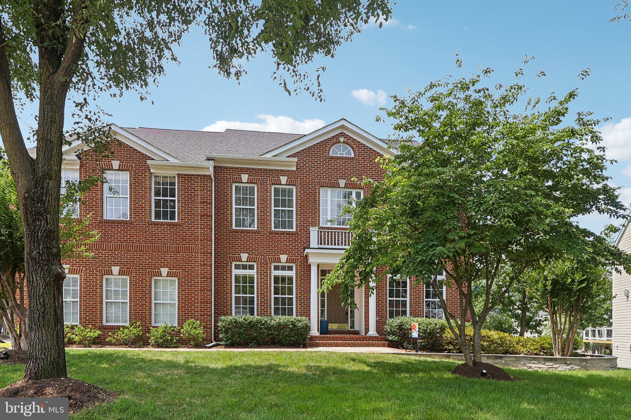 Timeless architecture, gracious proportions, and an exceptional Broadlands South setting come together in this beautifully appointed Fitzgerald II model. Perfectly positioned on a premium corner lot, this distinguished residence offers four bedrooms, four full bathrooms, one half bath, and a thoughtfully designed floor plan created for both sophisticated entertaining and comfortable everyday living. A desirable side-load garage enhances the home’s elegant curb appeal, while the corner setting provides added privacy and a sense of openness.

Inside, light-filled living spaces and impressive architectural details create an atmosphere that feels both refined and welcoming. A private main-level office offers an ideal setting for working from home, while the sunroom provides a peaceful retreat surrounded by natural light. At the heart of the home, the dramatic two-story family room makes a striking impression with soaring ceilings, expansive windows, and a bright, airy ambiance. Generously sized rooms flow seamlessly throughout the main level, offering abundant space for intimate gatherings, formal occasions, and relaxed daily living.

Located in one of Ashburn’s most sought-after communities, Broadlands South offers an exceptional lifestyle surrounded by natural beauty and resort-style amenities. Residents enjoy three seasonal swimming pools, tennis and pickleball courts, basketball courts, a fitness center, numerous playgrounds, community gathering spaces, and miles of scenic walking and biking trails that wind through preserved natural areas, parks, and open green spaces.

Everyday conveniences are close at hand at Broadlands Village Center and Broadlands Marketplace, with grocery stores, restaurants, cafés, medical offices, shopping, and services just minutes away. Nearby Broadlands Boardwalk Park offers an enchanting escape into nature, featuring a picturesque boardwalk through protected wetlands. This exceptional home presents a rare opportunity to enjoy elegant living, a premier corner-lot setting, and the outstanding amenities that make Broadlands South such a desirable place to call home.