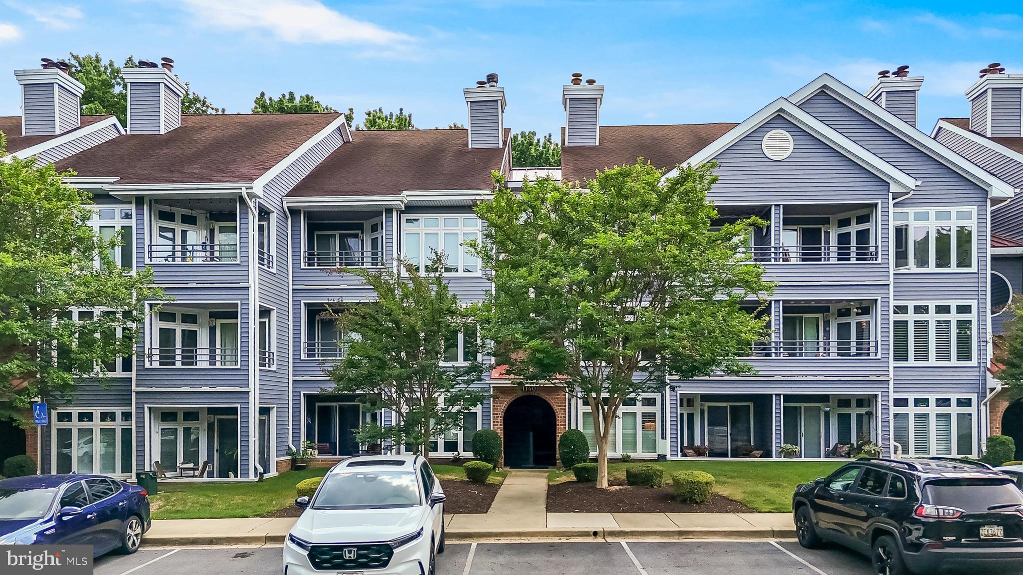 Welcome home to this beautifully maintained 2-bedroom, 2-bathroom second-floor condo offering stylish updates and comfortable living! Step inside to find gleaming engineered hardwood flooring, and a stunning stone accent fireplace. The kitchen features quartz countertops, white cabinetry, a stone backsplash, stainless steel appliances (2024-2025), and an island with additional storage. The spacious primary suite boasts three closets and a private en-suite bath with dual sinks. Enjoy the convenience of a new washer and dryer (2024), as well as a private balcony with additional storage space. Additional updates include siding replaced in 2020. Residents can take advantage of community amenities including a swimming pool and fitness center. Meticulously maintained and move-in ready, this charming condo is ready to welcome its next owner!