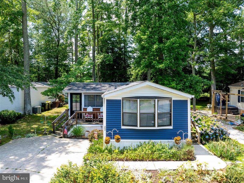 *NEWLY PRICED AND READY FOR ITS NEXT OWNER* Experience coastal living in this vibrant, amenity-rich Rehoboth Bay MHP community. This charming home features two bedrooms positioned at opposite ends for added privacy. Enjoy your morning coffee or an afternoon drink on the screened porch or the small front deck, both of which overlook the fountain pond. If you enjoy gardening, you'll love the beautiful flower garden space where you can plant your favorites or care for the existing plants. Situated about 4 miles from the Rehoboth Beach Boardwalk, this home offers an affordable vacation getaway or a perfect year-round residence in Rehoboth. Discover why this home is ready to be enjoyed in any season and why it might be the ideal choice for you!