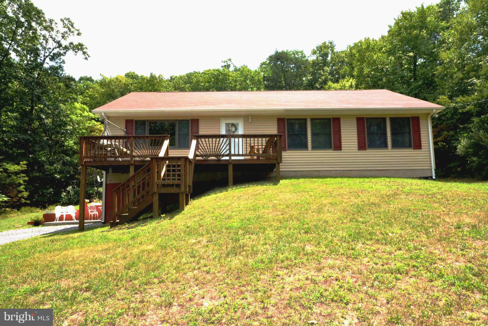Don't need to look any further! Come and see this charming home for a quieter & more relaxed lifestyle.  Enjoy the privacy & beautiful country setting atmosphere.  Home offers hardwood floors, large living room & kitchen for family gatherings, large master bedroom, front deck for entertaining, build/shed with woodstove.  Home approx. 20 miles from Winchester - Off state maintained road.