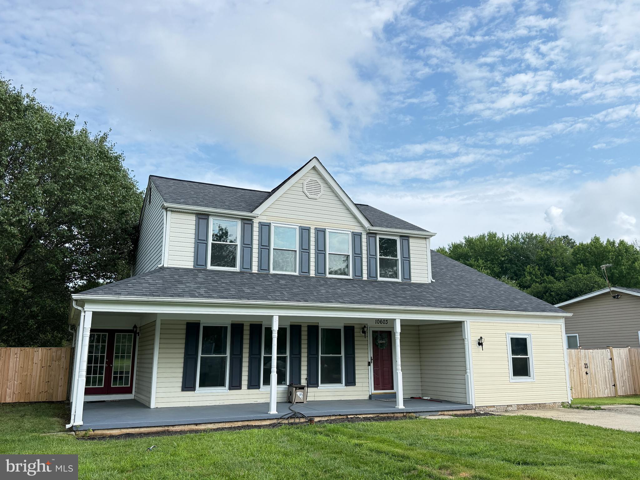 Welcome to this stunning 4-bedroom, 2.5-bath colonial tucked in the sought-after Cheltenham Woods community of Prince George's County. Pride of ownership shows in every detail. From the moment you arrive, the wide wrap-around front porch sets the tone for the warmth and character found throughout this beautifully updated home.  Step through the front door into a welcoming foyer with a natural flow. The formal living room is to the left, the staircase to the upper level to the right, and straight ahead to the custom kitchen, with a convenient powder room tucked in between. The formal dining room is a standout feature, with elegant French doors on the left side of the home providing both a gracious secondary entrance and an abundance of natural light. The living and dining rooms together offer a wall of windows that flood the main level with sunshine throughout the day.  The heart of the home is the beautifully upgraded kitchen (2025), showcasing abundant quartz countertops, upgraded cabinetry, luxury vinyl plank flooring, and a breakfast area that opens to a cozy family room with fireplace. A slider off the family room leads to your private rear deck overlooking a large, level, fully fenced backyard, ideal for outdoor entertaining, pets, or play. A generous storage shed with electric and window air conditioner completes the outdoor package.  Upstairs, the primary suite impresses with a vaulted ceiling and a beautifully appointed ensuite bath featuring a separate shower, tub, and elegant tile work. Three additional well-sized bedrooms and a full hall bath round out the upper level, all finished with updated carpet (2021). Pull-down attic stairs lead to a floored attic with room for plenty of storage. Main level features durable laminate hardwood-look flooring (2021).  Major systems have been thoughtfully upgraded, including the heat pump and air handler (2025) and quality double-hung windows with transferable warranty (2019).   Located just minutes from US-301, with easy access to Washington, D.C. (approximately 20 miles), MARC commuter rail, Cheltenham Park's 116-plus acres of green space, the Southern Maryland Regional Farmers Market, and all the shopping and dining of the surrounding Prince George's County corridor. No HOA.  This incredible home has been freshly paint and is move-in ready!  Make it yours TODAY!
