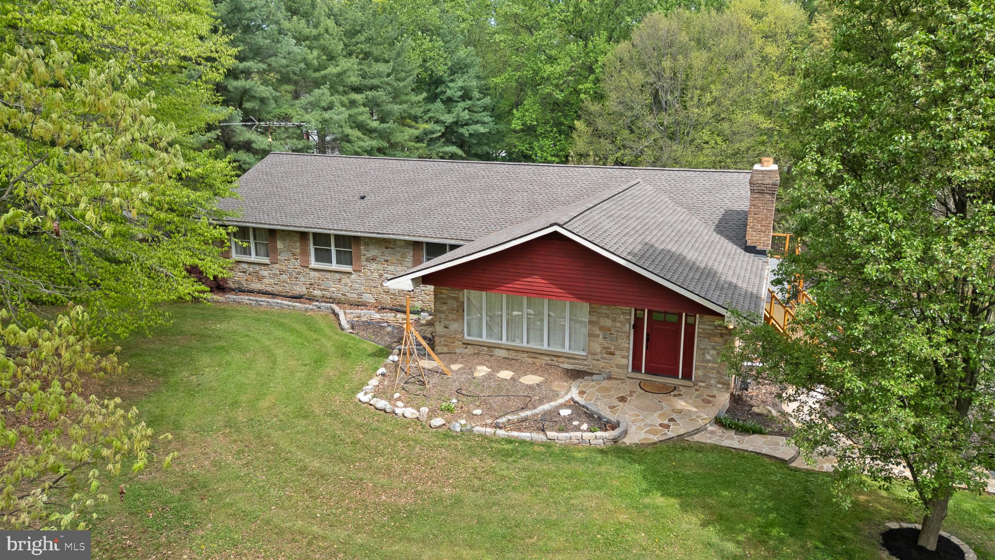 PROPERTY HIGHLIGHTS: Custom-Built, Detached, Real Natural Stone Front, and 3-Sided-Brick, Rancher Style Residence, 3 or 4 Bedrooms, 3 Full / 1 Half Bathrooms, 2 Finished Levels, 1 Fireplace,
Solid Construction and Loaded w/Desired Amenities, Features, and Recent Remodeling and Updates, 
Spacious Room Sizes, High Ceiling Heights, and an Approximate Total Square Footage: 5,018 Square Feet, 
Park-Like, Nature-Filled, 3.61 Acre, Treed, Wooded, and Private Setting, 
Long, Macadam Driveway w/Multi-Car Parking Areas, an Attached Garage, and an Oversized Detached Garage / Workshop, More!!!INTERIOR: Spacious, Impressive Formal Living Rm w/Gorgeous, Custom, Real Natural Stone Fireplace w/Raised Stone Hearth (21' Long), Wood Mantle, Mesh Screen, Natural Gas Log, 10 Ft Ceiling, Crown Molding, Recessed Ceiling Lighting, Front View Casement Windows, and Hardwood Flooring, Dining Room w/Large Table Area, Pantry Closet, Storage Closet, Recessed Ceiling Lighting, Rear View and Side View Casement Windows, Rear and Side Entry/Exit Doors to the Wrap-Around Deck, and Hardwood Flooring, Custom, Remodeled (2022), Entertainer's Eat-In Kitchen w/Cherry Cabinetry, Granite Countertops, and Ceramic Tile Backsplash, Center Island w/7 Foot Long Breakfast Bar w/Counter Overhang, 6 Burner, Natural Gas Cooktop, and Overhead Exhaust Hood w/Lighting, Deep Bowl. Farmhouse, Cast Iron Sink, All Kitchen Appliances Included: Refrigerator/Freezer w/Ice Maker and Water Dispenser, Built-in Electric Wall Oven and Microwave, Built-in Dishwasher, Sink Disposer, Pantry / Storage Closet, Recessed Ceiling Lighting, and Hardwood Flooring,  Archway to Long, Main Level Hallway w/Recessed Wall Shelves and Hardwood Flooring, 3 Main Level Bedrooms (Originally a 4 Bedroom Floor Plan, the Primary Bedroom was Expanded), Primary Bedroom w/Spacious Sleeping Area, 2 Walk-In Closets w/Lights, Recessed Ceiling Lighting, Ceiling Fan, Wall-to-Wall Carpet, and Glass Sliders to the Primary Bedroom Rear Deck,  Primary Remodeled, Luxury Bathroom w/Walk-In Shower w/Ceramic Tile Floor and Surround, Bedroom 2 w/Walk-In Clothes Storage Closet and Access to Adjacent Full Bathroom, Wall-to-Wall Carpet, Bedroom 3 w/Wall-to-Wall Carpet,  Main Level Hallway Guest Half Bathroom, 
Main Level Laundry Room w/Full-Size Washer and Electric Dryer, and Utility Sink, Full Lower Level w/Large Room Sizes, Lots of Storage Area, and Space for Additional Rooms: Recreation Room w/Full Bathroom, LVP Flooring, Rear Entry/Exit Glass Sliders from/to the Rear Patio, Sunken Family Room w/Bar Area, and Great Space for a Theatre, for Tabletop and Video Gaming, and Additional Rooms, 
Attached, 2-Car Garage (28Wx23D) w/Rear, 7 Foot Roll-up Door, w/Auto Opener, EXTERIOR:
Stone Front, 3-Sided Brick, Low Maintenance Exterior, w/Aluminum Siding and Trim, Andersen Windows,
New Roof (6/2022), 3 Decks, Rear Yard, Macadam Basketball Play Area w/Lines, Pole and Backboard Included, Private, Serene, 3.61 Acres, Treed and Wooded, for your own Backyard Retreat and Playground, 
Enjoy the Variety of Birds and Wildlife, including Deer, Cardinals, Hawks, Owls, Fox, Rabbits, Squirrels, More, Seasonal, Living Mural, Landscape Scenes, Long, Macadam Driveway w/Multi-Car Parking Areas, 
MECHANIC'S DELIGHT: Oversized, Detached, High Ceiling, Deep Bay, 2 Bay Garage/Workshop (Exterior 47Wx30D), (Left Side Bay 28Dx17W), (Right Side Bay 28Dx18W) w/10 Foot High and 14 Foot Wide, Roll-Up Doors, a Service Door to the Multi-Use Room great for an Office or Storage, and a Full-Length Upper Level Loft. Room for Multiple Cars, Car Lift, More. Great for Automotive, Trades, Workshop and/or Arts Enthusiasts, UTILITIES: Forced Air, Natural Gas Heat and Central Air (New 2022). Electric Hot Water Heater (New 2022), Public Water and Public Sewer (New Grinder Pump System Newly Installed and Paid in Full by Seller (6/2026)), AVAILABILITY: Property is Easy-to-See. Sellers can accommodate a Quick Closing and Move-In Date, More!!!