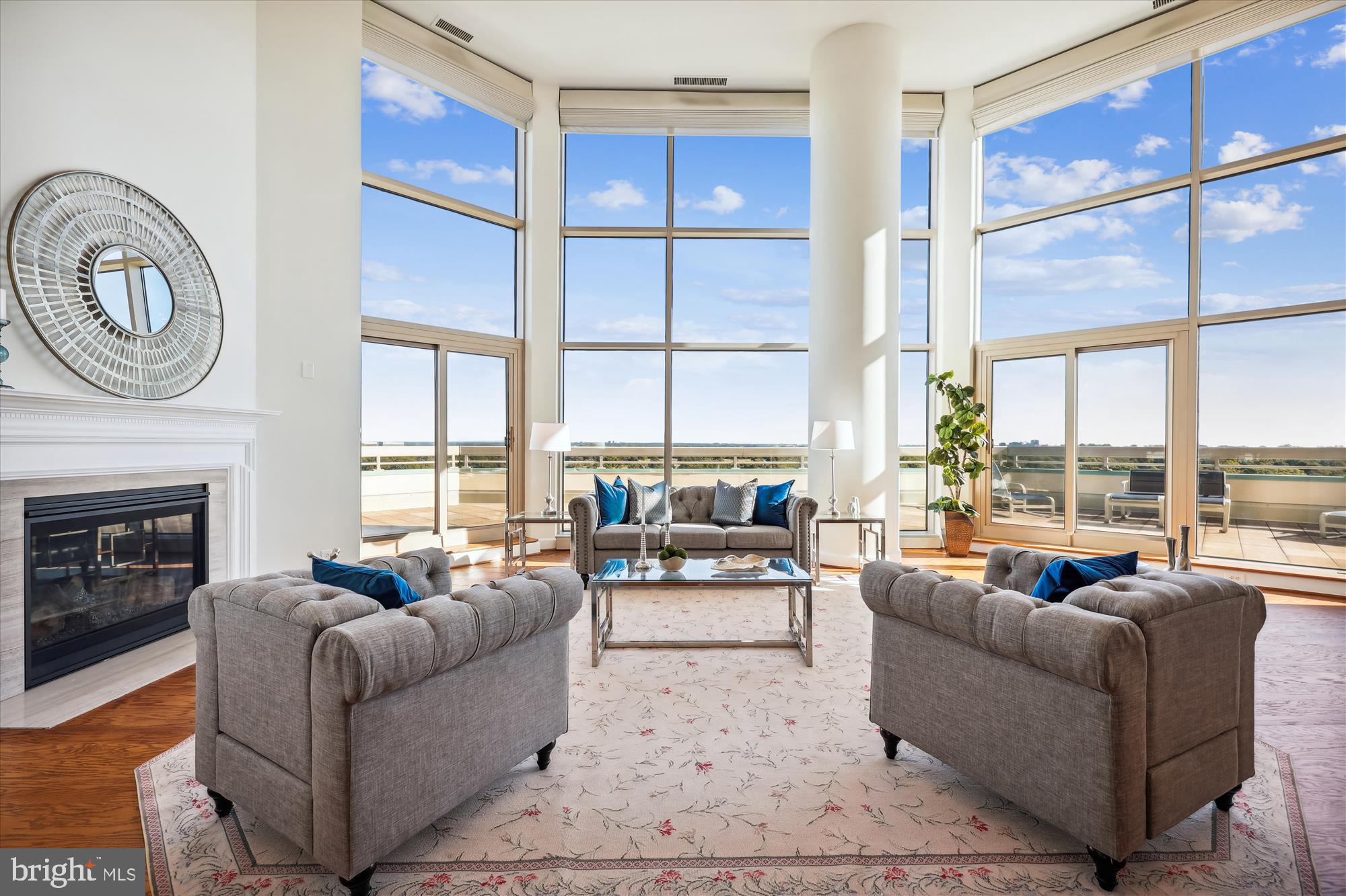 Magnificent 5,285 sq ft. penthouse, with its substantially wide, wraparound terrace and sensational east/north/west views from every room, is not to be missed!  From the welcoming foyer to the open  2-story living room (with gas fireplace, walls of glass, electric shades and sliders to the expansive terrace),  the cozy family room, formal dining room, a huge gourmet kitchen with island and breakfast room, laundry room, multiple closets,  a powder room, and onward to the spectacular primary bedroom suite (with multiple walk-in closets, 2 primary full baths, plus the huge bedroom chambers and sitting room area), there are so many outstanding and gracious amenities throughout this beautiful home.    Stairs to the upper level lead you to the wide hall art gallery overlooking the living room,  a powder room, library/office (with another gas fireplace), multiple large storage closets, plus 2 other bedrooms with ensuite full baths and walk-in closets.    Beautiful hardwood floors, recessed lighting and many custom built-ins throughout.

Set amidst 17+ acres of lushly landscaped grounds, you'll experience elegant, resort-like living in the most luxurious condo complex in Chevy Chase/Friendship Heights.  Amenity-rich, the gated community enjoys 24-hour security, beautifully landscaped grounds/gardens, tennis courts, a 3-story clubhouse with indoor & outdoor pools, party rooms, a state-of-the-art fitness center, racquetball, basketball court, billiards & ping pong room, aerobics room, and the list goes on and on.  All within a leisurely stroll to a plethora of shops, dining options, and the Friendship Heights Metro Station!