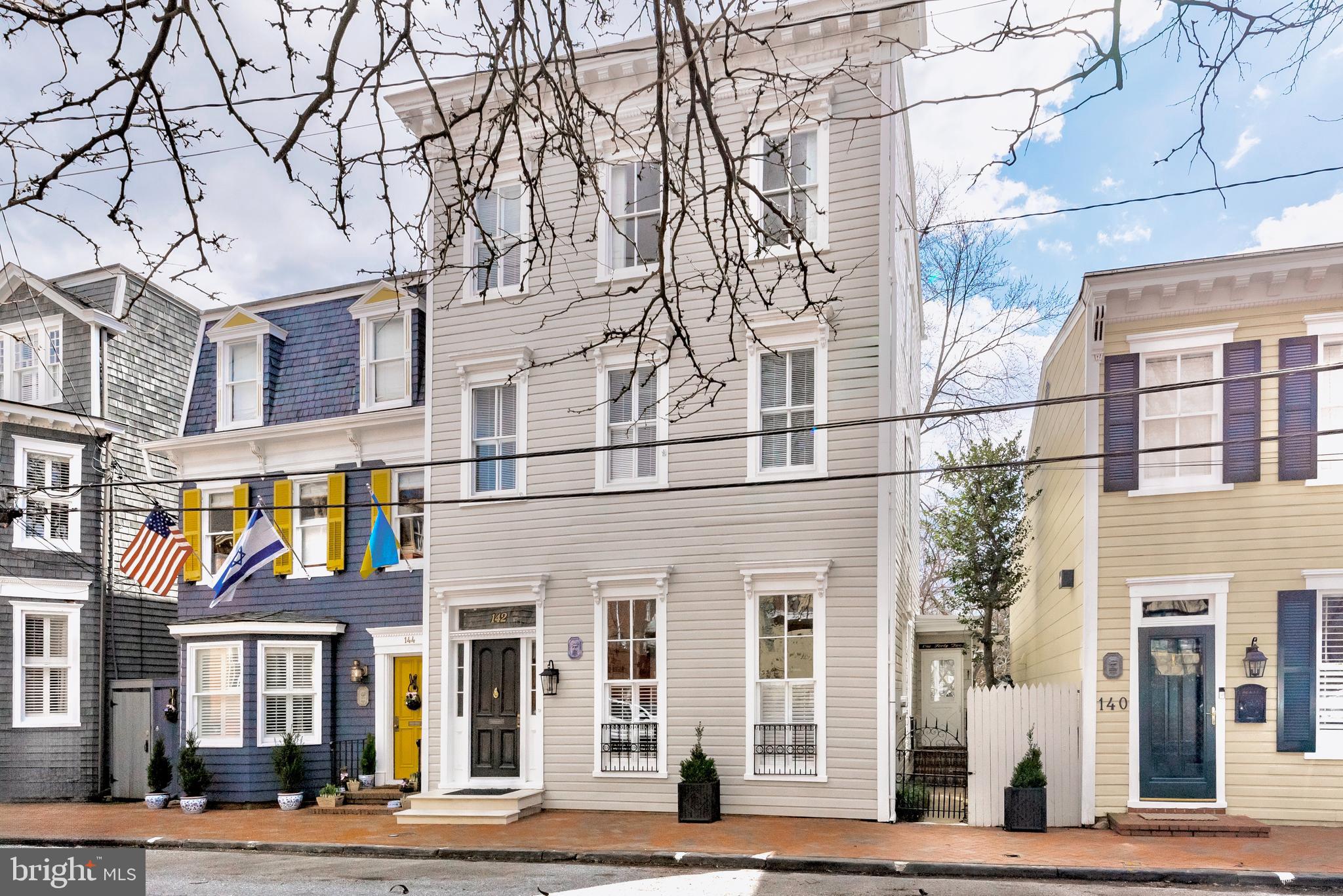 Welcome to this elegantly appointed historic home located on Charles Street in Historic Annapolis. Built sometime between 1880 and 1885 by the Cobbler from the U. S. Naval Academy, this stunning home stands proud as an homage to the Italianate style in which it was built.  A few houses in from Duke of Gloucester, this home is centrally located where you can walk to all the shops and eateries with ease but manages to be a quiet spot at the same time. Enter the home through the charming vestibule and center hall boasting tall ceilings and beautiful colonial moldings. Enjoy hosting guests in your spacious contemporary gourmet kitchen featuring a large kitchen island, custom tile backsplash, granite counter tops, stainless appliances and sleek white cabinetry. Several skylights and architectural picture windows offer a tremendous amount of natural lighting. Many of the historical features of the home have been preserved including the hand carved banister with decorative scroll stair brackets and two non-working fireplaces. From the gracious rooms featuring hardwoods throughout the 3.5 finished levels, to the 5 bedrooms and upgraded bathrooms, you will have plenty of space for everyone. The homeowner added a bedroom level laundry for convenience and there is an additional laundry hook up in the basement.  You will find ample space for storage in the basement as well.  This property is perfect for entertaining from the kitchen that flows nicely into the family room to the private fenced brick courtyard and garden with mature trees.  Host your guests for an outdoor dinner party under the stars. Don't want to cook?  Main Street is only a block away.  Stroll to "Duck Park" at the bottom of the street to gather with neighbors, hop on the water taxi or launch your kayak or paddle board.  Live the elegant life of Annapolitans of a bygone era with all the conveniences of the modern world.  There is a reason Annapolis is voted one of the top places to live time and again. Come see for yourself!