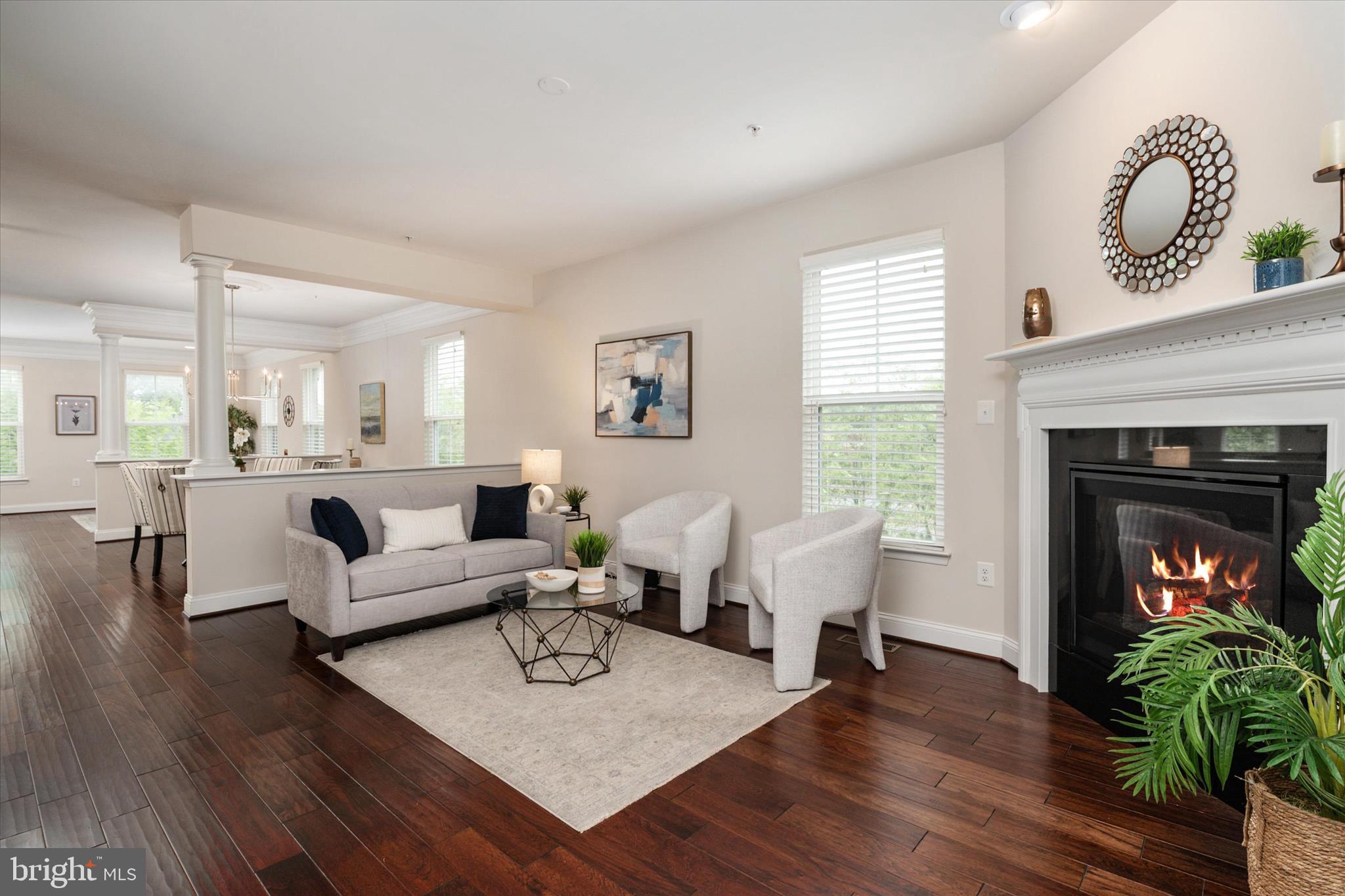 PRICE REDUCED! An incredible value in Annapolis! *** Beautiful, light-filled end-unit residence in the Village Greens of Annapolis, offering extra privacy, generous living space, and 14 additional windows not found in typical interior models. From the moment you step inside, the home feels bright, open, and welcoming, with natural light highlighting the engineered hardwood floors throughout the main levels.
The main living area is warm and inviting, anchored by a cozy gas fireplace and an easy flow into the kitchen and dining spaces. The kitchen is a true centerpiece of the home, with premium cabinetry, a large center island with seating, a pantry, and ample space for everyday living or casual entertaining. Elegant doors open to a private deck, creating an easy spot for morning coffee, outdoor dining, or a quiet evening outside.
The dining and living spaces feel polished yet comfortable, with updated light fixtures, generous windows, and room to gather. You’ll enjoy a tranquil view of landscaped community green space.  As an end-unit, this home offers a level of light and privacy that makes a noticeable difference.
Upstairs, a charming loft-style nook offers space for a reading corner, small office, library, or exercise area. The primary suite is bright and spacious, with soaring ceilings, four large windows, two generous walk-in closets, and a well-appointed bath with a double vanity, soaking tub, and separate shower. Two additional bedrooms, a second full bath, a linen closet, and a dedicated laundry room complete the upper level.
The entry-level area offers versatile options for expanding your living space, serving as a private home office, workout area, creative studio, guest room, or a flexible space that adapts to your changing needs. It features its own entrance and half bath, providing practical separation while maintaining a feeling of connection to the main home. The attached rear-entry two-car garage and private driveway ensure ample parking and extra storage. 
This convenient location in the gated community of Village Greens is just minutes from Historic Downtown Annapolis, Eastport, local marinas, restaurants, shops, and the US Naval Academy. Enjoy easy access to Navy football games, Blue Angels week, waterfront dining, and everything that makes Annapolis living so special. Nearby Routes 50 and 97 make commuting to Fort Meade/NSA, BWI Airport, Baltimore, and DC a breeze. Bright, expansive, move-in ready, and beautifully situated, this end-unit Annapolis home offers the comfort, flexibility, and lifestyle you have been seeking. Welcome Home!