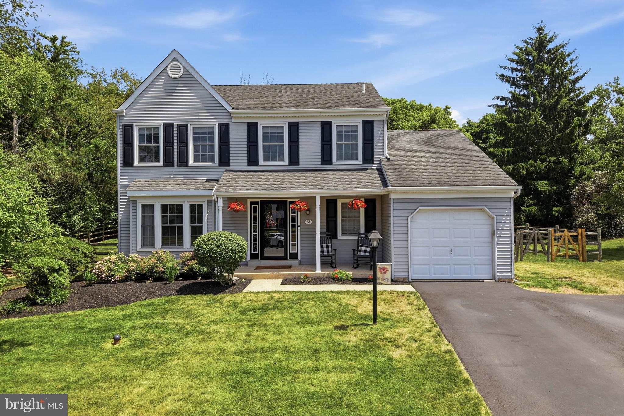 This beautiful Colonial offers exceptional curb appeal and a warm, welcoming presence from the moment you arrive. Perfectly situated at the end of a desirable cul-de-sac, with no neighboring home on one side and a tree-lined backyard, this property offers a wonderful sense of privacy. A charming covered front porch, expanded driveway, one-car garage, private fenced backyard, and an EP Henry patio complete the inviting exterior, ideal for outdoor entertaining and everyday enjoyment.

Inside, you'll find a thoughtfully updated interior with hardwood flooring throughout the first floor and an elegant hardwood staircase accented by box newel posts and black iron balusters. The kitchen is designed for both style and function, featuring granite countertops and backsplash, along with a center island. Custom lighting,  gooseneck faucet, coffee bar, and a complete suite of GE stainless steel appliances, including a convection microwave/oven, 5-burner gas range, Energy Smart dishwasher, and French door refrigerator with ice maker and lower freezer. The adjoining breakfast area is filled with natural light and features French glass doors that open to the EP Henry patio, creating a seamless transition for indoor and outdoor dining and entertaining.  The spacious family room is highlighted by a skylight and will feature a brand-new professionally installed electric fireplace prior to settlement, creating a modern focal point with year-round ambiance and low-maintenance convenience. As part of the upgrade, the original prefabricated wood-burning fireplace will be permanently taken out of service and the chimney will be professionally sealed and capped with a new stainless steel chase cover!

Upper level features upgraded carpeting which adds comfort throughout. The spacious primary suite features a ceiling fan, walk-in closet, and private bath.  The two additional generously sized bedrooms  include ceiling fans and spacious closets.

Lower level features a finished basement with playroom, office area with closets, custom lighting along with a huge storage/utility room. Major updates include a Carrier HVAC system (2021) and Infiniti GS Series wall-mounted Tankless Water Heater (2024).

Outside, the generous fenced backyard offers plenty of space for entertaining, recreation, gardening, or simply relaxing while enjoying the peaceful, wooded backdrop.

Conveniently located near Fisher's Park, General Nash Elementary, Pennfield Middle School and North Penn High School. Enjoy easy access to Route 476 for effortless commuting to King of Prussia, Philadelphia and surrounding areas.  Don't miss this exceptional opportunity to make this beautiful home yours!
