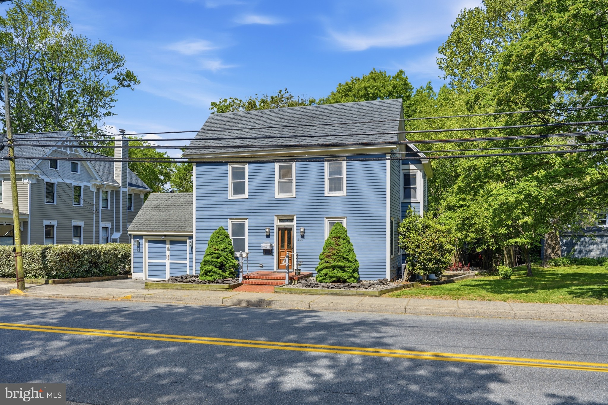 Presenting a home where history meets amenities! This colonial style home is situated in the convenient and pristine location of downtown Lewes directly in front of the beautiful Al Stango Park and the old Queen Anne's Railroad. If there was ever a home with an abundance of character, this is one for the ages. Featuring 3 bedrooms, 2 bathrooms and unparalleled storage. With original qualities like the old refinished hardwood flooring and 3rd floor loft area are still intact and ready for use! Read a book in the first floor parlor with a cozy fireplace or drink coffee on the large screened back porch. The mother-in-law suite and workshop building along with multiple outbuildings create an atmosphere of infinite possibility. The classic feel of historic Lewes with added bonuses make this property truly unique. The lot itself has a massive backyard with multiple decks and patios perfect for hosting gatherings or dinner parties. Just imagine a short bike ride to the beach and bike trails or an even shorter walk to the local library and vibrant nearby restaurants. You are at the center of everything the charm of Historic Lewes has to offer.