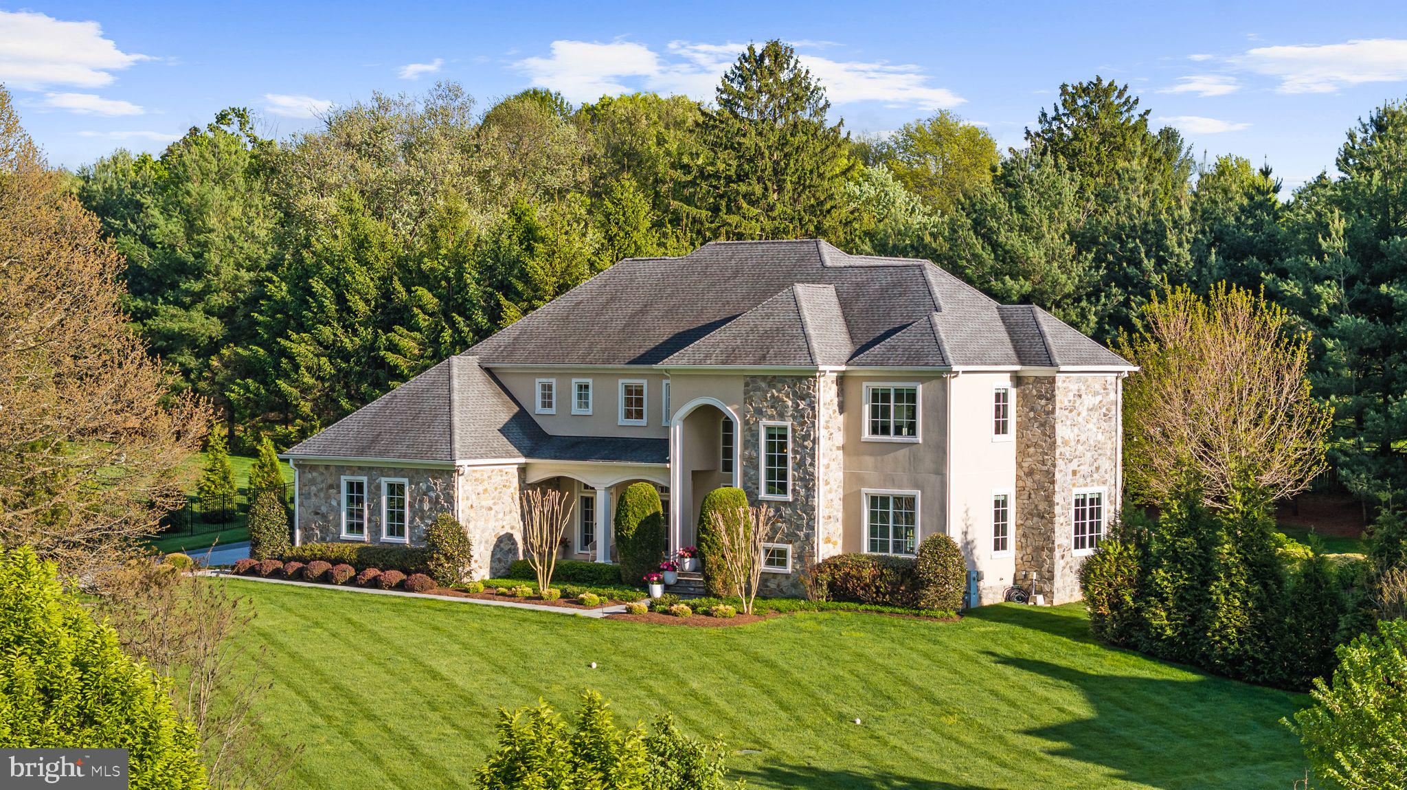 Stunning stone and stucco custom built 6 bedroom, 7.5 bath luxury residence located in the highly sought-after community of Worthington Green. Meticulously maintained and lightly lived in, many aspects of the home still feel as almost new construction. Designed for both everyday living and elegant entertaining, the home features an open concept gourmet chef’s kitchen equipped with a double island that seamlessly flows into a spacious breakfast area and inviting family room with a fireplace.

The main level offers exceptional versatility, including a private first-floor bedroom or playroom with en-suite full bath, an expansive formal dining room, a dedicated home office, two walk-in pantries, and a stylish powder room—all enhanced by 10-foot ceilings and 8-foot doors throughout.

Upstairs, the luxurious owner’s suite serves as a true retreat, complete with an oversized marble spa-inspired bath and an impossible to fill 20x16 dressing room. Four additional en-suite bedrooms and a conveniently located laundry room complete the upper level.

The fully finished walk-out lower level is designed for entertainment and relaxation, featuring a recreation room with wet bar, an additional bedroom with en-suite bath, and a state-of-the-art home theater with stadium seating.

Additional highlights include whole-home audio, an expansive stone patio, a separate stone fire pit patio, and a three-car garage.

Set on one of the only lots in the neighborhood without a home across the street, the property offers rare privacy and picturesque, park-like views of trees and open meadows from both the expansive front yard and many windows throughout the home. All in one of Baltimore County's most desirable neighborhoods!