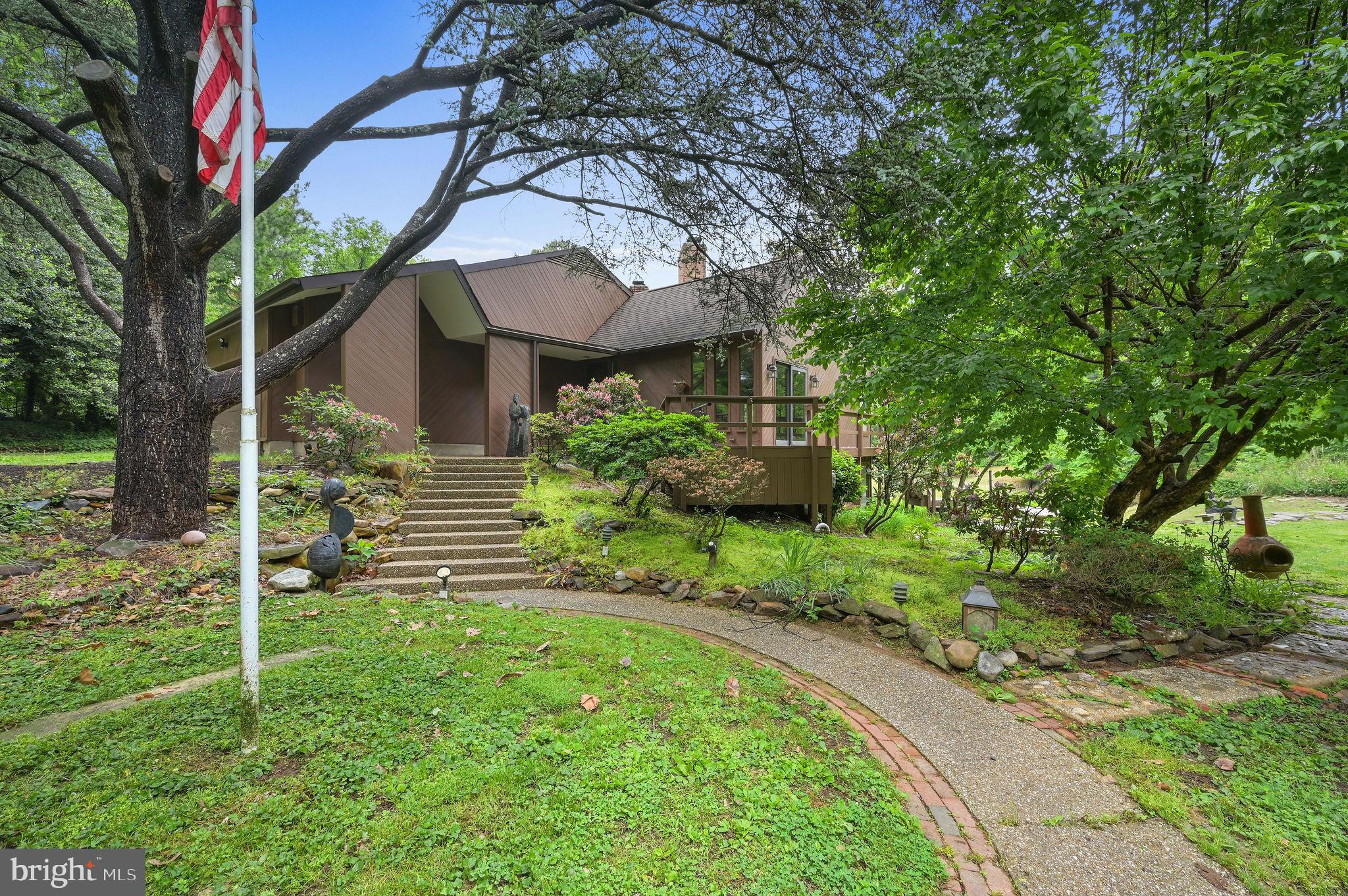 One of a kind home close to town with room to roam between 4-5 acres with a pond.  Wrap-around rear deck and great windows to soak in the water view of the pond. Open kitchen to the dining area with fireplace and a bonus room for formal dining or can be used as a beautiful sun room.  Step down living room with fireplace and hardwood floors. There is a large office with fireplace and great views of the pond. Family room and library on the lower level with woodstove.  Two garage attached garage and an additional garage going into the basement.  Tons of storage.  Rental includes grass cutting, tenant maintains landscaping, weeding, trimming.