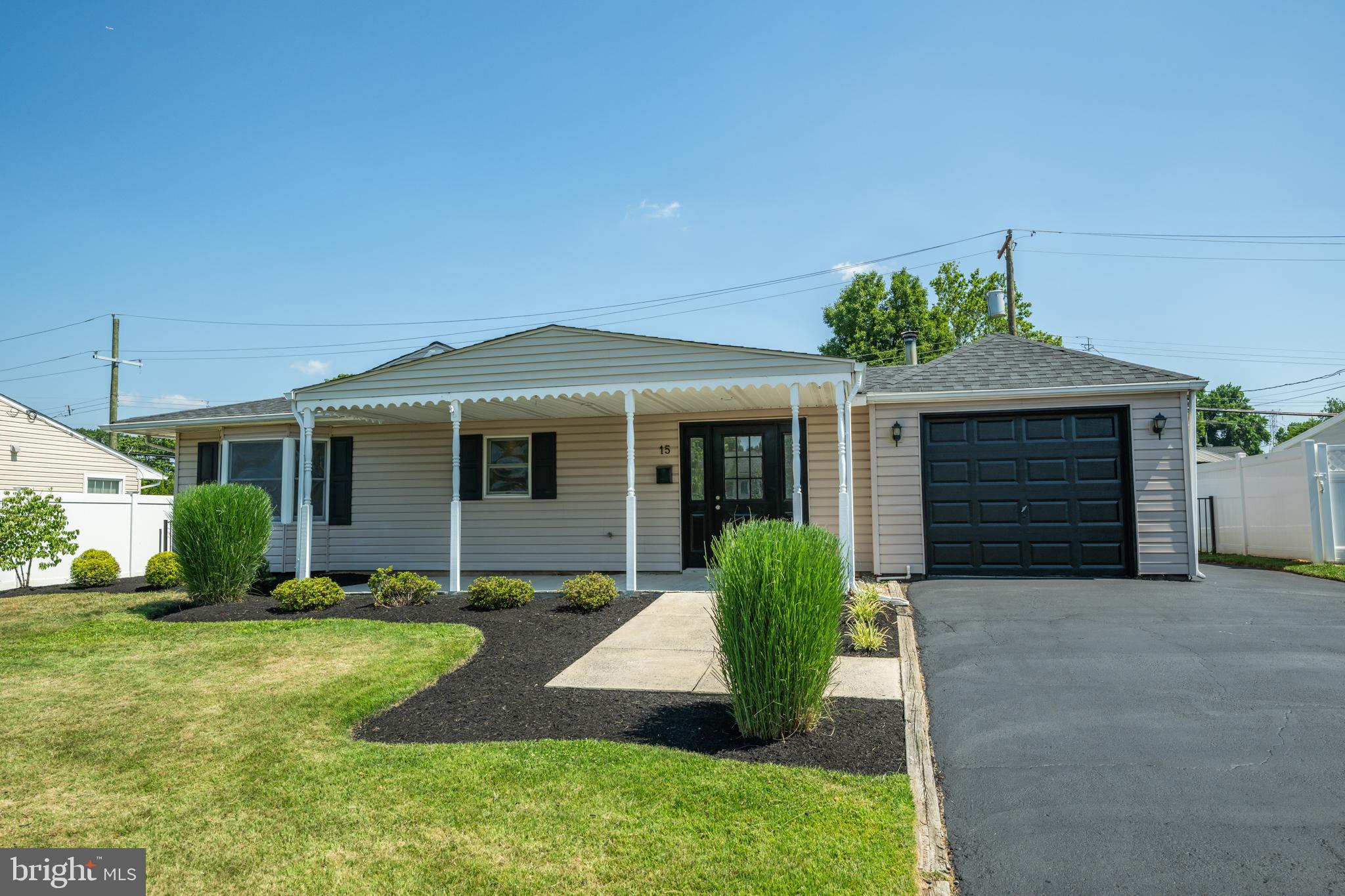 Welcome home to this charming 3 bedroom home located in the Indian Creek neighborhood of Levittown. Boasting new flooring and thoughtful updates throughout, this home offers the perfect blend of comfort and style. Freshly manicured landscaping and inviting curb appeal welcome you to your covered front porch. Step inside to your bright and spacious living room featuring direct access to your backyard patio - perfect for indoor/outdoor entertainment! Continue to your updated eat-in kitchen featuring white cabinetry, a stylish tile backsplash, stainless steel appliances, and ample counter and cabinet space! Just beyond, your cozy family room showcases a charming bay window that fills the space with natural light and offers direct access to your side yard. Down the hall, you'll find three spacious bedrooms, each with plush carpeting and abundant natural light and a beautifully updated full hallway bathroom with a floor to ceiling tiled stall shower. The primary suite features a private en suite bathroom complete with a tub/shower combo! A coat and linen closet provide ample storage and round out the home. Step outside to your fenced backyard, offering a patio for social gatherings and plenty of space for outdoor games, gardening, and activities. A bonus shed provides convenient storage for all your outdoor essentials. This home features an attached garage and private driveway for ample parking! Located close to a variety of shopping and restaurants and near Levittown Station providing direct access to Center City, I 295 and the PA turnpike for easy commuting! Don't miss your opportunity to see this beautiful home today!