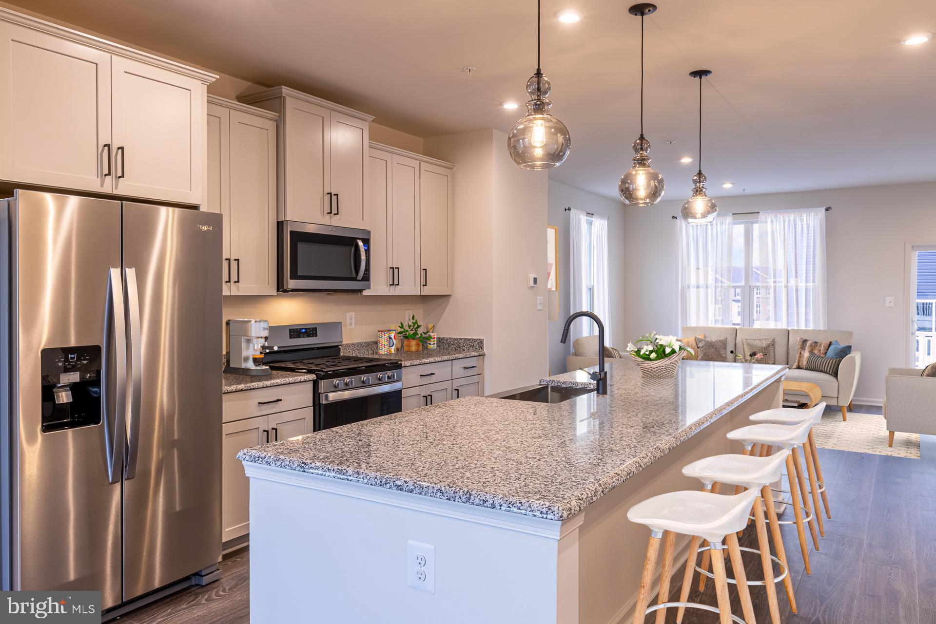 The Cambridge is a stylish three-story townhome that blends modern design, comfort, and functionality in a thoughtfully crafted layout. The open-concept main level offers seamless flow between the kitchen, breakfast area, and great room—perfect for entertaining or everyday living. The entry-level recreation room provides versatile space ideal for a home office, fitness area, or movie nights, while the rear-load two-car garage enhances curb appeal and adds convenience. Upstairs, spacious bedrooms offer privacy and comfort, with a layout designed to maximize usable space throughout the home. Enjoy the benefits of low-maintenance townhome living with the feel of a single-family home. Located within Taylor Highlands—a new phase in a well-established Ellicott City community—residents have access to exceptional amenities including a pool, clubhouse, fitness center, tennis courts, and tot lot, with even more planned for the future. *Beazer Homes is proud to be America’s #1 Energy‑Efficient homebuilder. Our FY25 average gross HERS score of 32 (38 excluding solar) was the lowest of the publicly reported scores among the top 30 U.S. homebuilders by volume identified by Builder Magazine’s Top 100 List (based on 2025 total closings). ** Photos are of the model home.  *** Pricing, features, and availability are subject to change without notice.