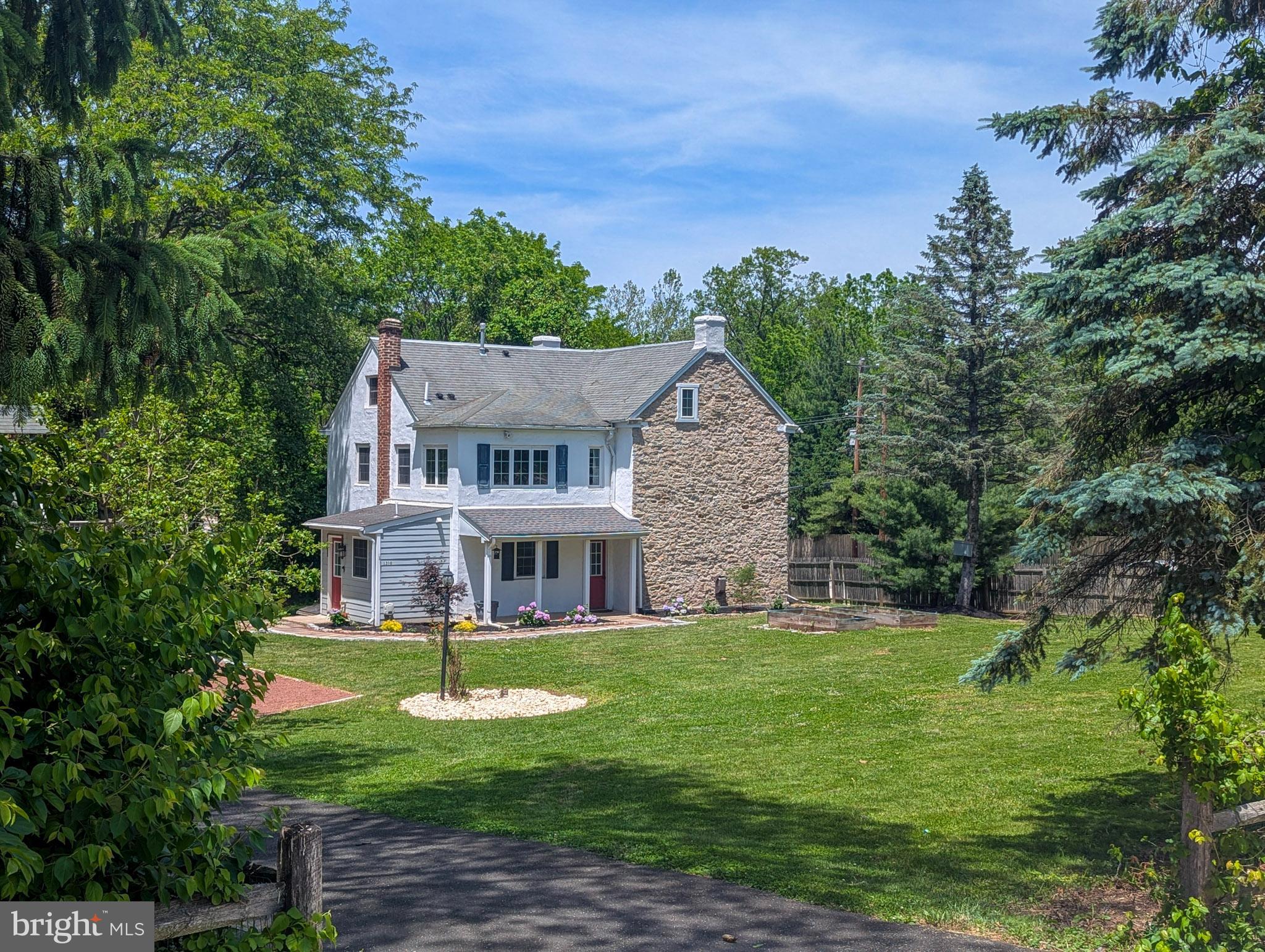 Step back in time without sacrificing modern comfort in this extraordinary circa-1800 stone farmhouse, nestled on nearly eight-tenths of an acre in historic Upper Dublin Township. Dating to the close of the Federalist Era and the dawn of the Jeffersonian Era, this remarkable residence showcases over 225 years of history, craftsmanship, and character, beautifully blended with the conveniences today's buyers expect.

Constructed with impressive 18-inch-thick stone walls, this one-of-a-kind home offers timeless charm throughout. The modern chef's kitchen features granite countertops, tile backsplash, stainless steel appliances, hardwood floors, and abundant workspace for cooking and entertaining. The spacious dining room is perfect for gatherings, while the oversized living room boasts beautifully refinished , old growth center pine wood floors and a warmth that only a historic home can provide.

The home offers three bedrooms, two and a half bathrooms, gas heat, multi-zone central air conditioning, a large basement with extensive storage, and a walk-up attic providing even more storage space.

Outside, bluestone walkways meander through the property, creating a picturesque setting worthy of its rich heritage. A detached carriage house offers three garage bays plus a beautifully finished heated and air-conditioned upper-level space ideal for a home office, studio, fitness room, guest retreat, or additional entertaining area. The stunning stone-and-wood barn presents endless possibilities for hobbyists, collectors, artists, or those seeking a truly unique property.

Backing to township-owned land, this private gentleman's estate offers an exceptional sense of tranquility while remaining moments from everything. Enjoy a short walk to the Cinnamon Drive entrance of Mondauk Park, with the playing fields and walking trails of Mondauk Commons just a quarter mile away. Shopping, dining, and entertainment in Fort Washington, Dresher, and Ambler are all nearby, while convenient access to Route 309 and the Pennsylvania Turnpike makes commuting a breeze.

Located within the award-winning Upper Dublin School District, this is a rare opportunity to own a sophisticated piece of Montgomery County history. Why settle for cookie-cutter when you can own a property rich in character, craftsmanship, and timeless appeal?