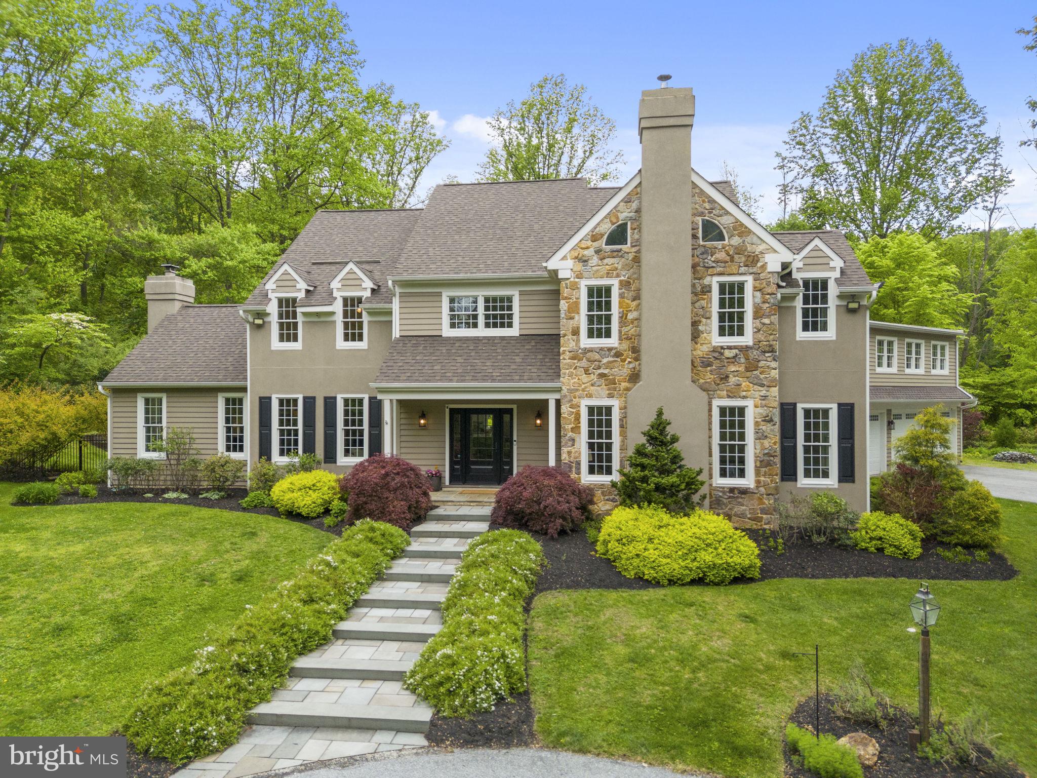 Elegant Estate on 2.6 Private Acres with Saltwater Pool, Hot Tub, Outdoor Kitchen & Guest Suite! Nestled in desirable West Vincent Township, Chester County, within the award-winning Owen J. Roberts School District, this distinguished 5-bedroom, 3/2 bath, 5,400+ square foot residence offers a life of quiet luxury and architectural scale. A three-bay garage with epoxy floors and EV charger is complemented by a private guest suite above with its own entrance, full renovated bathroom, and kitchenette, ideal for an in-law suite, extended stays, multi-generational living or office space. The resort-style outdoor oasis is designed for both relaxation and entertaining, creating a seamless indoor-outdoor lifestyle. 

The experience begins along the private drive, where professional landscaping, a circular driveway, and abundant parking create a warm welcome, complemented by a new outdoor stone fireplace. Inside, a grand two-story entry foyer with gleaming hardwood floors makes an unforgettable first impression. Flanked by a private office to the left and an elegant bar lounge complete with new carpet, a new fireplace and new wood-burning stove, perfect for effortless entertaining. At the heart of the home, the chef-inspired eat-in kitchen is appointed with crisp quartz countertops, a designer tile backsplash, and premium appliances. A generous center island with seating invites casual gatherings, while a dedicated beverage refrigerator keeps wine, beer, and cold drinks perfectly chilled. French doors open directly to the ultimate al-fresco entertaining experience, an expansive tile patio complete with a Forno Venezia wood-fired pizza oven, a Weber grill with rotisserie and gas burner, and fully piped gas and electricity. Beyond the patio, a stunning saltwater in-ground pool & spa with a cascading waterfall and a free-standing saltwater hot tub complete this private resort-style retreat.  A designated fire pit area and storage shed complete the grounds. 

Back inside, the family room captivates with soaring vaulted ceilings, a dramatic floor-to-ceiling wood-burning fireplace, and grand arched windows that flood the space with natural light. A dedicated main-floor laundry room with granite countertops, custom cabinetry, and built-in storage for coats and bags adds everyday convenience, while a well-appointed powder room completes the main level. The primary suite is a true sanctuary, boasting a dramatic vaulted ceiling, two generously sized walk-in closets with custom shelving, and a spa-inspired ensuite bath complete with a soaking tub, elegant tile shower, and dual vanities. Three additional well-appointed bedrooms offer comfort and flexibility for family and guests alike, while the finished attic provides an enchanting fifth bedroom. The lower level expands the home’s living space with a fully finished basement offering exceptional versatility, including a media room, dedicated fitness area, and a spacious game room complete with a pool table and projector screen. 

Additional features include major garage bump out renovation (2023-2025), new HVAC system for upstairs (2024), new water heater (2024), new wood stove/fireplace in lounge (2023), new epoxy garage floor (2023), new EV charging station, major outdoor kitchen/patio upgrade (2021-2022), new saltwater hot tub (2021), new Sonos audio system, 65kw whole house generator, windows installed (2018), roof installed (2016), saltwater heated pool and spa installed (2014). With significant upgrades, this home is as turnkey as it is beautiful! The location offers the best of Chester County living, enjoy farm-to-table dining at White Dog Cafe or classic steakhouse fare at the historic Seven Stars Inn, explore the charming boutiques, art galleries, and cafés along Bridge Street in downtown Phoenixville and spend weekends on the trails at French Creek State Park, all just minutes from your door. Schedule your private tour today to experience this unparalleled property firsthand!