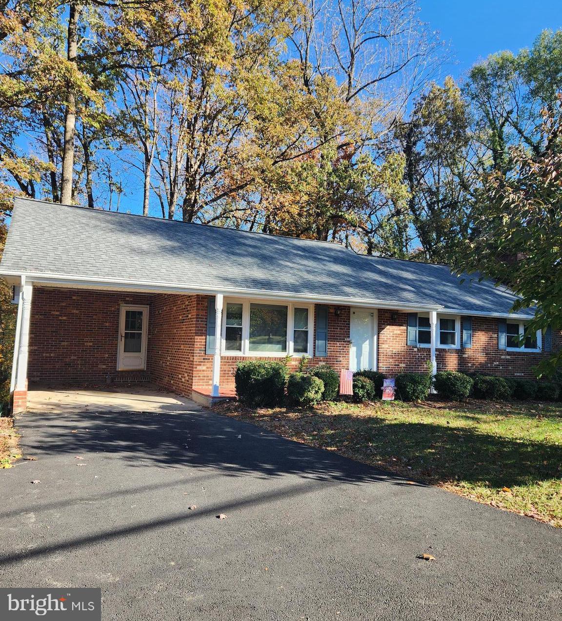 Established  neighborhood setting  within minutes from  Downtown Fredericksburg!  Super convenient location to Rte 1 giving you access to shopping and commuting.  Hardwood floors throught the first level with LVP in kitchen and family area.  Three bedrooms and 3 bathrooms.  Newly installed HVAC system and hot water heater gives you peace of mind and comfort.   New appliances will not disappoint.    Three spacious bedroomson the main level all featuring hardwood floors. Spacious primary bedroom on main level  with en suite.  The walkout basement provides additional living space and versatility. Full bathroom on the basement level. There is a room that was used at one time as a bedroom could be an office, storage, rec area - your choice.  The house backs up to woods offering privacey.   Very easy access to I-95 and the VRE.  Front porch to enjoy.   Use the carport as additional relaxing space with easy access to the kitchen.