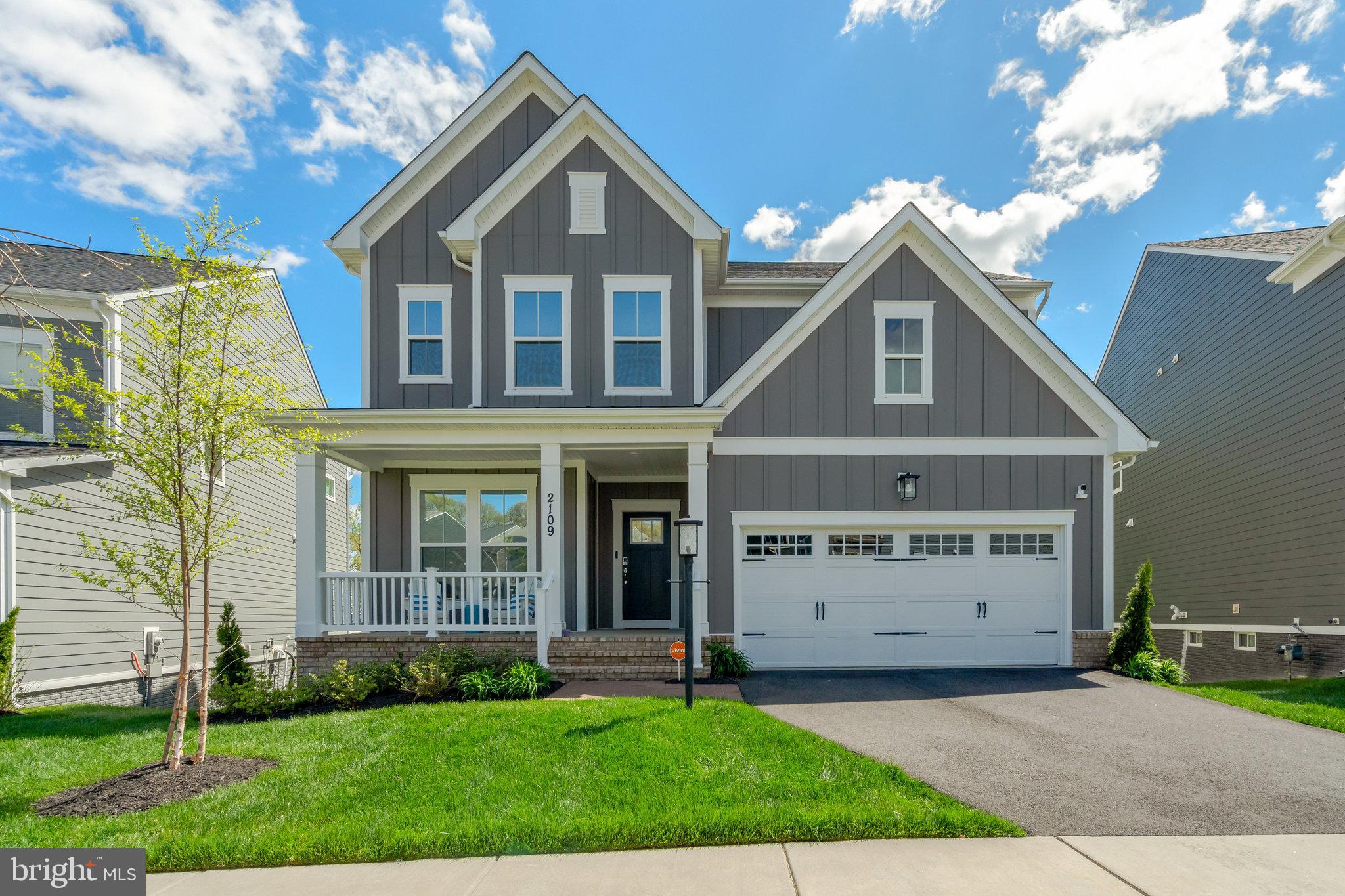 An impressive residence built in 2022 with 5 bedrooms and 5 bathrooms, seamlessly combining modern features with timeless classic style.  Set on a premium lot in prestigious Potomac Shores, this home offers a sought-after location that maximizes privacy and stunning views.  The front window overlooks open space, with the home across the street oriented away; meanwhile, the rear windows and deck showcase stunning vistas of treetops and the Potomac River. This premier setting blends tranquility and scenery, providing the perfect balance of seclusion within a vibrant and exclusive community, ideal for luxurious yet comfortable lifestyle living.

The transitional floor plan greets you with an impressive sightline from the front door to the rear of the home, emphasizing open, airy living spaces. Thoughtfully designed, the main level features a bedroom and full bathroom, providing convenience and accessibility for guests or multigenerational living. The breakfast area, with its sliding door, opens to a Trex deck—a perfect retreat for savoring serene mornings or unwinding in the peaceful ambiance of nature.

In the heart of the home, the living room features two custom bookcases flanking the fireplace, adding elegance and practicality. Remote-controlled undershelf lighting enhances these bookcases, allowing you to adjust the ambiance to suit any occasion.

Upstairs, the design masterfully combines privacy with practicality. A spacious loft serves as the central hub, separating the junior suite, which includes a private ensuite, from the primary suite and two additional bedrooms.  The upper-level laundry room is thoughtfully located near the bedrooms and equipped with a utility sink, seamlessly combining practicality with convenience to enhance the ease of everyday living.

At the end of the hall, the primary suite becomes a sanctuary. It features a tranquil sitting area and a spa-inspired bathroom with dual showerheads. From this vantage point, enjoy breathtaking views of the river and the surrounding community.

The fully finished basement offers exceptional versatility and abundant space, complete with a full bathroom and sliding doors that seamlessly connect to the outdoors. Its generous layout provides ample room to create an additional bedroom while maintaining expansive living areas, making it ideal for entertaining, a sophisticated home office, or a recreational retreat. With limitless possibilities for customization, this space elevates the home's overall functionality and charm.

Equipped with modern amenities designed to elevate your lifestyle, such as: a whole-house water filtration system with a softener for pristine water quality; an upgraded HVAC system with an air scrubber and U/V light for healthier air; professionally installed tint on all windows/sliding doors for added comfort and energy efficiency; underground front yard sprinklers for effortless maintenance; and a custom hall tree at the garage entrance helps keep space organized and clutter-free.

This extraordinary home offers stunning views, luxurious details, and modern conveniences, all nestled within a welcoming community that balances tranquility with easy access to world-class amenities. Located near Shores Club pools, gym, social barn, plus Potomac Shores Golf Course, Clubhouse, and Tidewater Grill, this home provides the best location and lifestyle for residents of all ages.

Potomac Shores features an extensive list of amenities, including swimming pools, a Fitness Barn perfect for workouts/yoga, multipurpose sports fields, and numerous walking trails. Various social activities, with opportunities for kickboxing, cooking classes, Sip-and-Paint nights, book clubs, and more. The community fosters connections through hobbies and passions, offering something for everyone.

Effortless commuting with access to I-95, and a community VRE station, now under development, enhances convenient travel.

Plan your appointment today for refined living tomorrow!