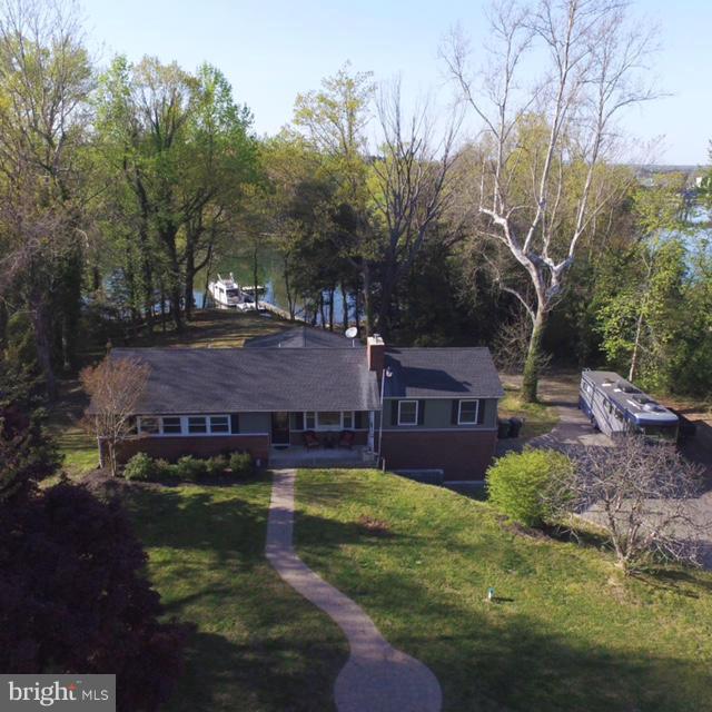 This Stunning Waterfront  home is in the heart of the St Mary's but tucked away for privacy.  This beautifully updated 3 bedroom, 3 bath home offers breathtaking water views and year round comfort.   Featuring three spacious living areas, including sunroom, this property sits on 2.62 acres along a protected creek with deep water access - perfect for boating enthusiasts!  The private pier is equipped with electric and a boat lift.

Seller upgraded roof, windows, well and septic system, ensuring peace of mind for years to come.  Additional highlights include a 2 car garage, and extended Amish built shed, and a relaxing hot tub.  Enjoy watching eagles and ducks in every season from your waterfront oasis.  There is a VA assumable loan as well as we are approved/perc for a 2000 sq foot house however, you will need to go through county for building permits.