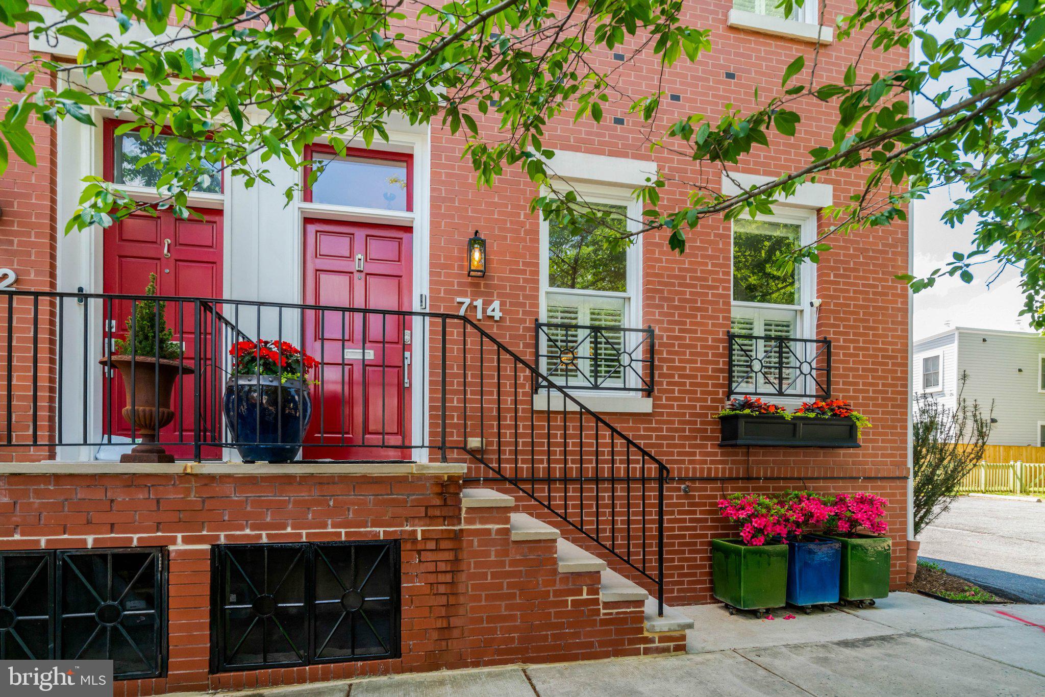 Tastefully remodeled and exceptionally upgraded, this stunning 5-bedroom, 4.5-bathroom townhome in highly sought-after Old Town Alexandria offers over 3,900 square feet of living space.

The main level features a bright, open floor plan with hardwood flooring, custom dimmable lighting, built-in shelving, and Sonos in-ceiling speakers. The remote-controlled gas fireplace features a custom floor-to-ceiling stone surround and smart temperature control. The remodeled kitchen is equipped with Viking appliances, new custom cabinetry, a 14’ x 4’ quartz island countertop, and a wine refrigerator. A conveniently located half bath sits on the stairway.

The entire second level is a self-contained primary suite. Highlights include hardwood flooring, custom lighting, Sonos in-ceiling speakers in both the bedroom and bathroom, and a remote-controlled electric fireplace with customizable color and temperature settings. The oversized walk-in closet leads to the remodeled primary bathroom, featuring premium tile, heated floors, dual vanities, a standing shower with dual shower heads, and a custom soaking tub. A laundry room is also located on this level for added convenience.

The third level offers three additional bedrooms with hardwood flooring, two of which include en-suite bathrooms.

Enjoy breathtaking panoramic views from the rooftop deck, complete with composite decking and railing, a water spigot, and electrical outlets. Take in unobstructed sunsets and direct views of Oronoco Bay—perfect for watching Alexandria’s annual fireworks.

The lower level is ideal for an in-law suite or rental opportunity, featuring new luxury vinyl flooring, a sound-dampening ceiling, a private bedroom, a full bathroom, a kitchenette, and a private entrance with a doggy door providing easy access to the backyard.

The fully fenced-in backyard is thoughtfully designed with a composite deck, remote-controlled electric awning with LED lighting, and professionally installed landscaping. A custom Corten Steel planter with water feature enhances the space, while providing a clear path for dogs to run around without damaging plants. The Rain Bird Irrigation System and SMRTscape Landscape Lighting can both be controlled via smartphone apps. A custom fence gap was created for dogs to look out, also providing convenient package delivery. Landscaping highlights include European hornbeams, weeping Japanese snowbells, weeping Colorado blue spruce, Flamethrower redbud, southern magnolia, fig tree, strawberry plants, and 3-season perennials.

Additional features include: Two-zone HVAC systems with regular professional maintenance. New gas package system (Sept 2025). New heat pump system (May 2021). Air scrubber and dynamic electronic air filter. Google Nest Pro Thermostats. New sump pump (May 2025). Commercial-grade 50-gallon electric water heater with expansion tank and auto shut-off (April 2020).

The property includes two dedicated and off-street parking spaces adjacent to the home, with additional owned space between the fence and the parking area.

Ability for elevator installation!

This exceptional home seamlessly blends luxury, functionality, and modern convenience in one of Alexandria’s most desirable locations. Don’t miss this rare opportunity! NO HOA!!! And for devotees of Trader Joe's, this home is literally across the street.