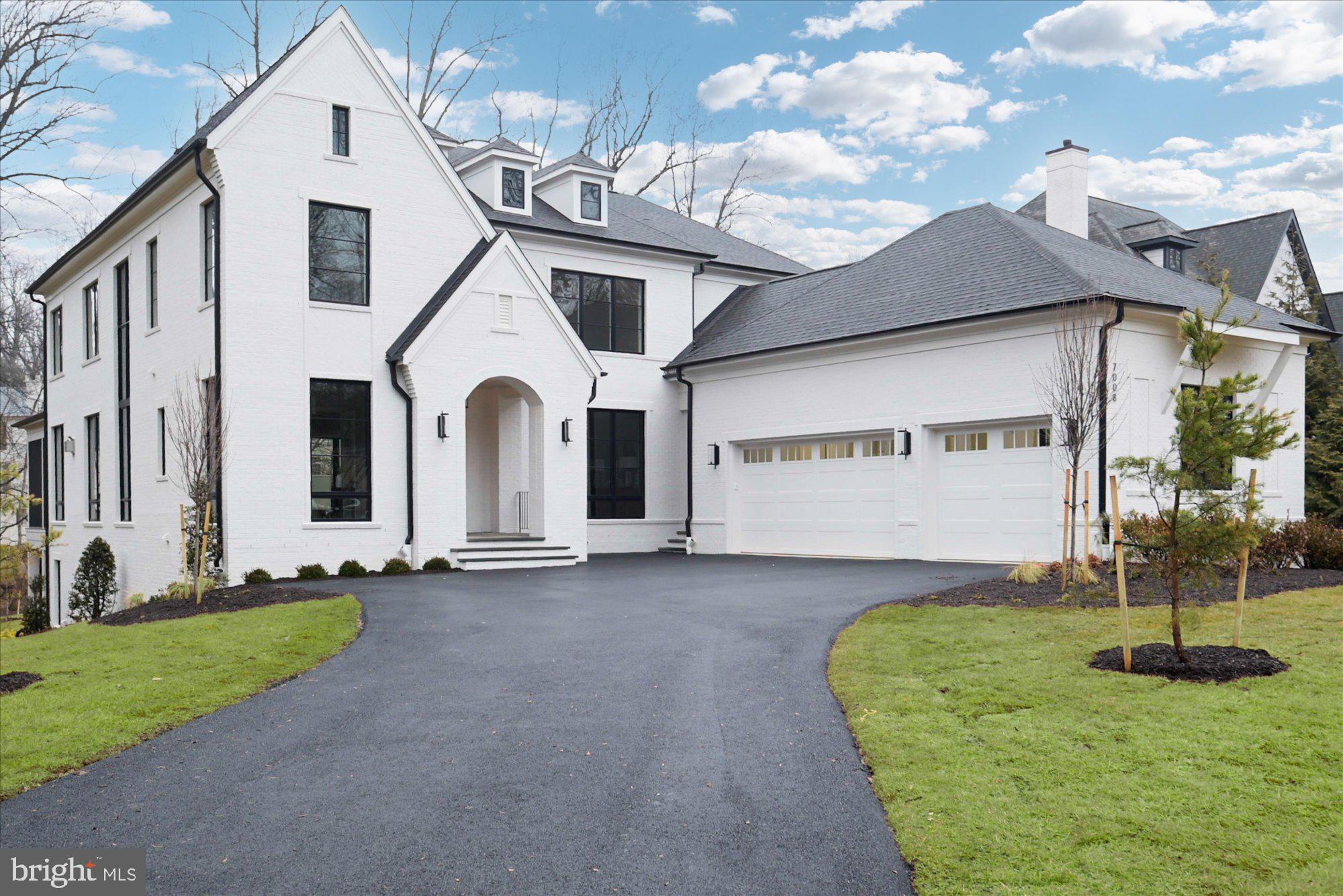 Welcome to the latest offering from Cherry Hill Custom Homes in the coveted McLean enclave of Langley Forest. This beautiful all-brick transitional design blends timeless elegance with contemporary sophistication. Spanning 7,881 square feet of impeccably finished living space across three levels, the residence offers five bedrooms, seven full bathrooms, two powder rooms, a three-car attached garage, dual staircases, and a fully installed elevator for seamless accessibility throughout.

Enter through the covered front porch into the main level, where 10-foot ceilings and herringbone white oak floors create a dazzling first impression. The gourmet kitchen features frameless custom cabinetry with paneled appliances, quartz countertops with island waterfall, and a rear prep kitchen/pantry with a 3rd dishwasher and extra refrigerator. The kitchen connects to a great room with a coffered ceiling and linear gas fireplace with tile surround. A breakfast nook overlooks the backyard, while the screened porch—complete with ceiling mounted heaters and a gas fireplace with stone surround—and rear deck offer outdoor living spaces for year-round use. A formal dining room with butler's pantry, a private study, a main-level guest suite, and a mudroom with built-in cubbies complete the main level living spaces.

The upper level is highlighted by a luxurious primary suite with a gas fireplace, dual walk-in closets with built-ins, and a spa-like bathroom with heated floors, double vanities, a freestanding soaking tub, and a curb-less heavy glass-enclosed shower. The walk-out lower level features a recreation room with wet bar, a covered patio with stone fireplace, an exercise room with rubber flooring, a flex room, two full bathrooms, and a safe room/workshop.

Sited on a professionally landscaped 30,890-square-foot lot—mostly flat and with full yard irrigation system and room for a swimming pool—this property offers convenient access to downtown McLean, Tysons Corner, and beyond.