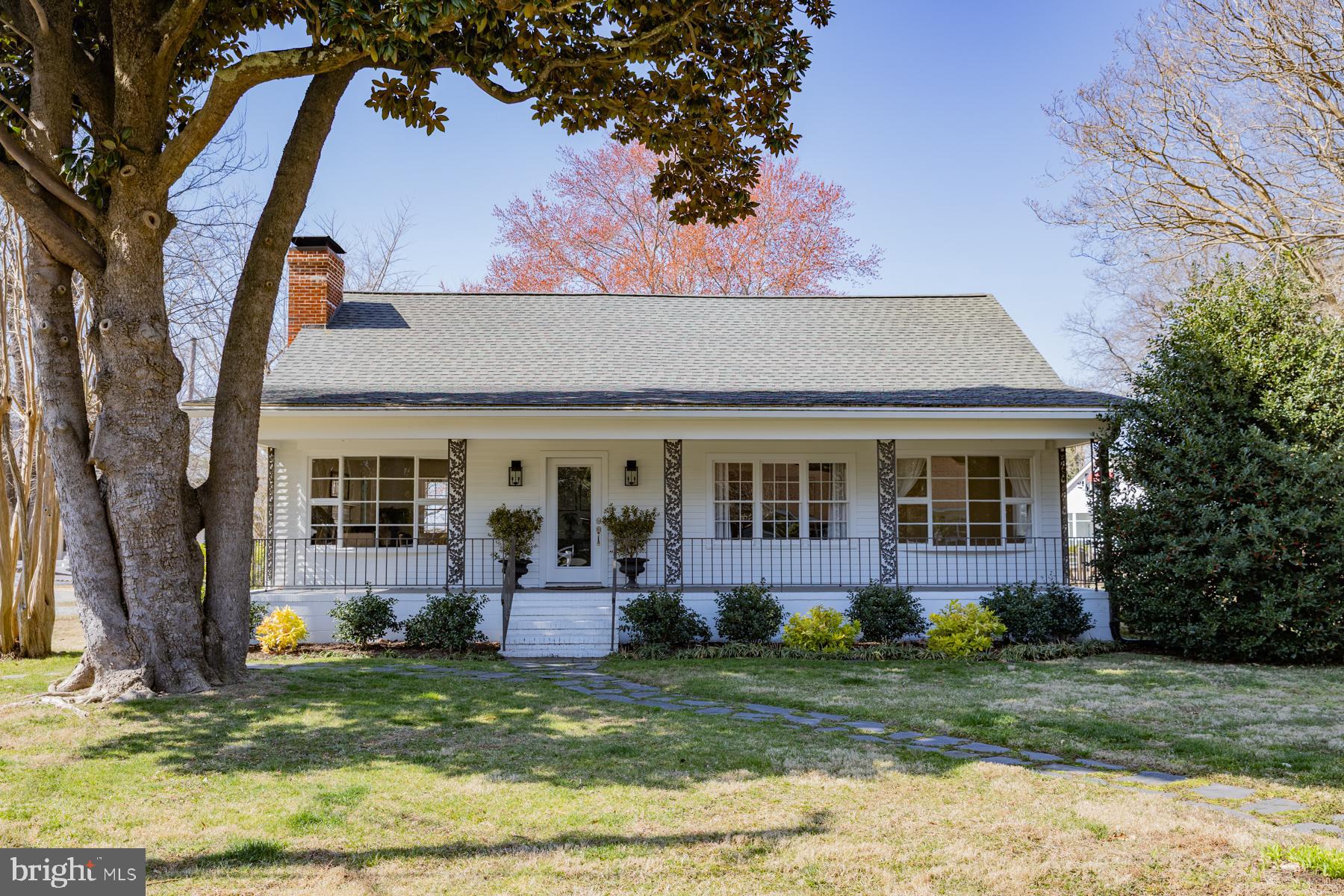 The quintessential cottage with views of Carter’s Creek, a new covered back deck overlooking a large fenced yard and a full length front porch bordered by lovely landscaping.  This 2 bedroom home in the heart of Irvington boasts a spacious living room with gas fireplace and creek views, a remodeled kitchen with center island, a separate dining room and family room (currently used as the primary bedroom) and two remodeled full baths. Hardwood floors, kitchen backsplash and faux tin ceiling, tiled showers and custom vanities are some of the details that give this home unmatched character.  Located within walking distance of everything  Irvington has to offer, this is an ideal place to watch sunsets over the creek and to call home.