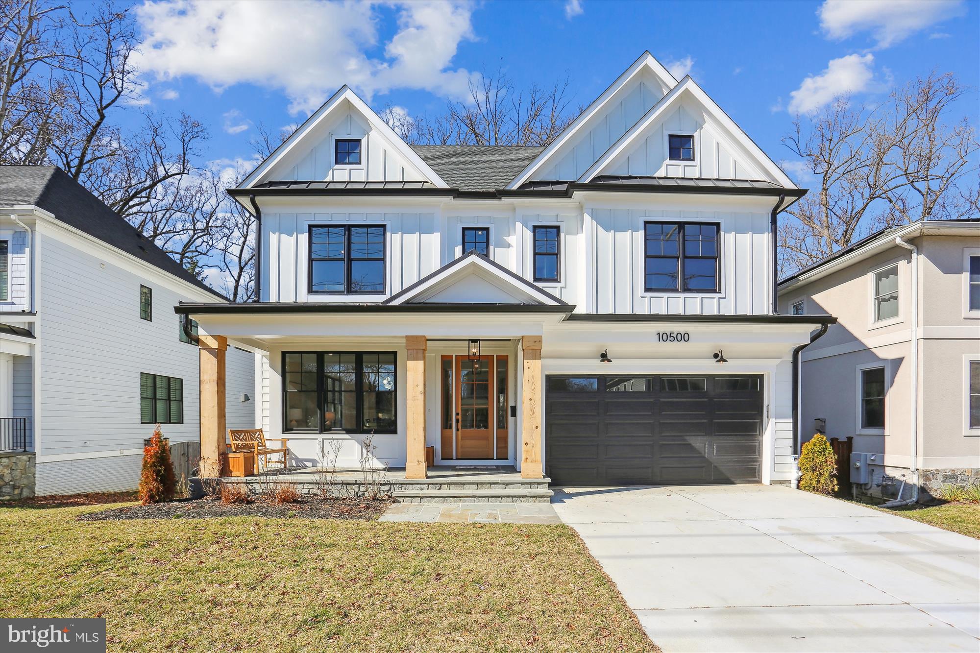 Welcome to 10500 Parkwood Drive, a spectacular newly constructed home crafted by the award-winning West Hill Builders. Meticulously designed with exceptional workmanship and the finest materials, this residence showcases unparalleled quality and attention to detail. Nestled on a beautiful lot backing to trees and park in the sought-after location of Kensington, this property offers both convenience and tranquility. 

Approaching the home, you are greeted by a flagstone walkway leading to a central portico, boasting an inviting front porch adorned with 12" solid cedar columns, overlooking the meticulously manicured front lawn. Stepping through the solid wood and glass front door, you are immediately captivated by the grandeur of the floor plan, spanning over 5,300 square feet.

The interior of this home boasts stunning features such as fabulous stained oak flooring, extensive millwork, and 9 + foot ceilings on each level. The craftsmanship is evident as you enter the exquisite foyer, with its striking grand staircase, private office to the right, and formal living room across the way. The living room seamlessly flows into a banquet-sized formal dining room adorned with a designer chandelier, creating an ideal space for entertaining.

The butler's pantry connects the dining room to the kitchen, providing the option for open-concept entertaining or a more intimate atmosphere. The kitchen itself is a chef's dream, featuring stunning contrasting cabinets, marble countertops, and top-of-the-line appliances from Jenn Air, including a 48" range, 48” custom refrigerator, and high-velocity exhaust hood. Adjacent to the kitchen is the family room, complete with a natural gas fireplace, custom millwork and expansive windows offering views of the verdant backyard. Direct outdoor access to the deck and yard further enhances the seamless flow between indoor and outdoor living spaces. Completing the main level is a powder room and a spacious mudroom area with custom built in cubbies and access to the two-car garage.

Ascending the grand staircase, you reach the upper level's central vestibule, which leads to a wide landing area. The primary suite is a sanctuary of space and luxury, featuring two large walk-in closets and a lavish bath. The bath offers a multitude of amenities, including a freestanding soaking tub, a multi-jetted shower, and heated floors in the exquisite wet room. Three additional generously sized bedrooms on the upper level each boast high ceilings and uniquely styled ensuite baths. A cozy second-story family room provides a perfect space for relaxation and can also function as a seventh bedroom if desired. Completing the upper level is a convenient main laundry room.

The home also offers a fantastic third level, comprising a large bedroom, a full bath, wet bar and a phenomenal bonus room, adding versatility to the floor plan. The lower level presents a spacious recreation room and storage rooms that can be tailored to suit your needs. It is perfect for entertaining, featuring a dry bar, combination wine/beverage center, a mirror-walled fitness center, a spacious bedroom, and a full bath. Stepping outside, the rear deck provides a serene retreat overlooking the lush trees.

This remarkable home is built to last, with features such as Hardie siding, a 50-year roof, Andersen windows, standing seam metal roof, oversized gutters, and even a Tesla/EV rough-in. It also includes a whole-house sprinkler system for added peace of mind. Ideally located just off Beach Drive, where no cars are allowed to drive on Saturday and Sunday, minutes away from downtown Kensington and Bethesda, and within close proximity to the Beltway, major airports, and Washington DC, this residence falls within the coveted Walter Johnson school district and offers easy access to all amenities.

With its stunning aesthetics, impeccable craftsmanship, and unbeatable location, 10500 Parkwood Drive is the epitome of the perfect place to call home.