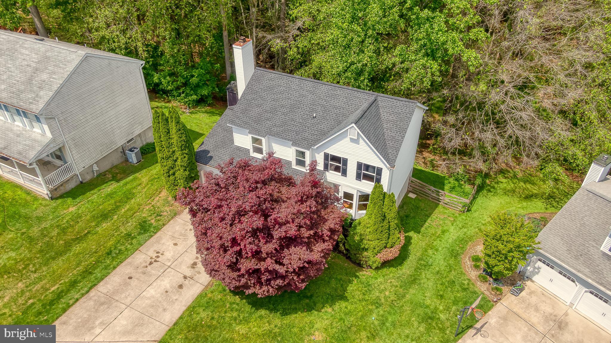 PRICED TO SELL!! Patterson Mill School district home with brand-new roof and gutters (2025), oil tank (2025) and garage doors with remotes (2026). Nestled in a quiet cul-de-sac within the highly desirable Broadview community, this spacious 4-bedroom, 2.5-bath colonial backs to trees with a rear deck and fire pit area. Inside, you'll appreciate the fresh neutral paint throughout (2026), crown and chair moldings and recessed lighting.  The beautifully refinished walkout lower level featuring luxury vinyl plank flooring (2024), creating the perfect space for relaxing, entertaining, or a bonus recreation area. The eat-in kitchen has been updated with 42-inch maple cabinets, granite counters, newer stainless steel appliances, including a refrigerator and dishwasher (2024), while the washing machine was replaced in 2023.