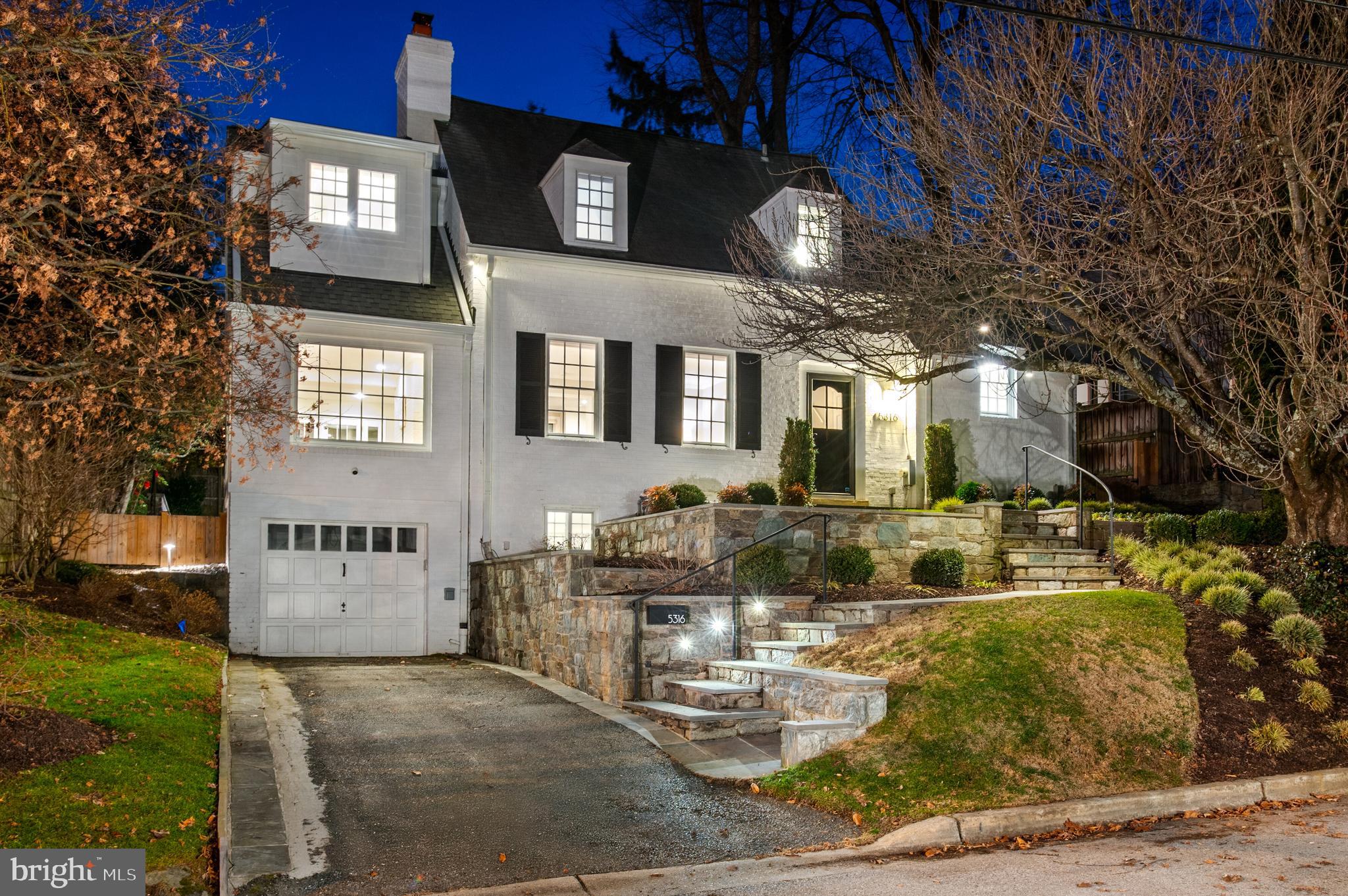 Nestled on a peaceful, tree-lined street in the sought-after Westhaven neighborhood, this beautifully updated and expanded 4-bedroom, 4-bathroom home offers both charm and modern luxury. The inviting exterior is matched by a sun-filled interior, featuring stunning hardwood floors, timeless finishes, and thoughtful updates throughout. The main level showcases a spacious formal living room with a cozy wood-burning fireplace, while the family room, with French doors leading to the back patio, creates an ideal flow for both relaxation and entertaining. The recently updated gourmet kitchen is a chef’s dream, with stainless steel appliances, quartz countertops, and a large center island with seating, all opening to a sunlit dining area.
A few steps up, you’ll find a peaceful bedroom with a walk-in closet and a private ensuite bath. On the second level, the expanded primary suite is a true retreat, complete with a newly added ensuite bath featuring a dual vanity, walk-in shower, water closet, and an expansive walk-in closet. Another bedroom and full bath with a tub/shower complete this level, offering plenty of space for family or guests. The lower level offers even more living space, including a recreation room currently serving as a home gym, an additional bedroom, a full bath, a laundry room, and access to the attached single-car garage. The professionally landscaped, fully fenced backyard is a serene escape, providing seamless indoor-outdoor living. The large slate patio is perfect for dining and lounging, overlooking the lush flat yard—ideal for both relaxation and entertaining. Located just over the MD/DC line, this home provides easy access to Downtown DC, Friendship Heights, and Downtown Bethesda. Westbrook Elementary School is within walking distance, and the Capital Crescent Trail is just a stone’s throw away, offering both convenience and an active lifestyle in a vibrant community.
