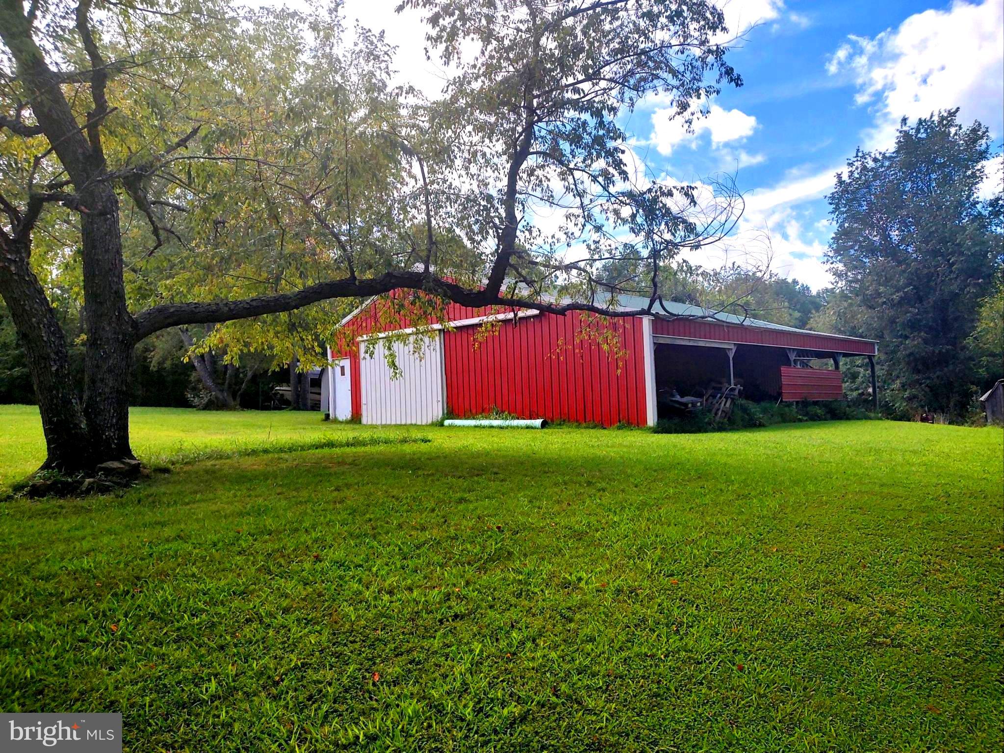 Wonderful 1.59 acre building lot at Lake Anna's Morgan II subdivision. Property is within Walking Distance to to the lake access.  Morgan II offers Boat access, ample parking, Family area with beach  and maintained in pristine condition.  The lot has it's own driveway,  several beautiful building sites, electricity on-site and the spacious shop/building.
