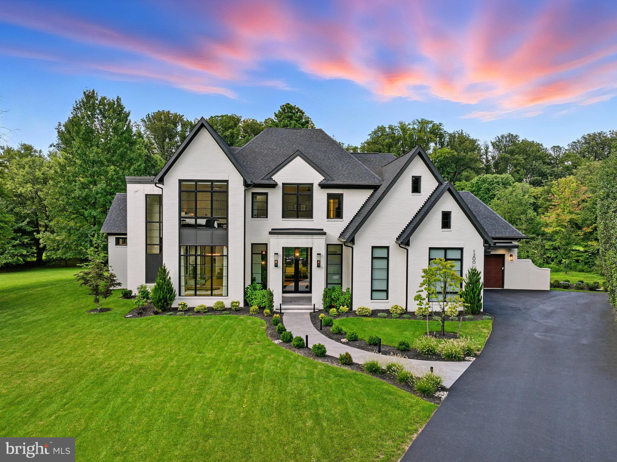 Welcome to 1200 Jossie Lane. A spectacular, award-winning, completely custom residence that  exemplifies a refined transitional design. This exceptional 5-bedroom, 5 full and 3 half bath home was thoughtfully created to capture natural light, frame picturesque views, and foster a seamless connection between indoor and outdoor living—all while backing to over 20+ acres of community parkland creating a truly serene setting. Spanning close to 9,000 total square feet, this home offers a perfect balance of architectural sophistication and everyday comfort. A sense of openness unfolds from the moment you enter, with carefully considered sight lines and fluid living spaces that guide you effortlessly from one room to the next. Expansive windows and walls of glass bathe the interiors in natural light while drawing attention to the surrounding views. The kitchen and adjoining dining space serve as the heart of the home, where modern design meets functionality. Surrounded by windows and overlooking the lush parkland beyond, the dining area offers a striking, light-filled alternative to a traditional formal space—perfect for both casual meals and elegant gatherings. The chef’s kitchen is outfitted with premium appliances, including a Wolf 48 inch dual-fuel range, built-in separate Sub-Zero refrigerator, freezer, and wine refrigerator, The Butlers Pantry/ Prep Kitchen features a Miele steam/convection oven, and a Miele built-in coffee & espresso system, 2- Sub-Zero refrigerators drawers  and a separate ice maker—delivering both performance and style.
The main living areas extend gracefully to a beautifully designed screened porch with a fireplace, gas lanterns, a motorized Phantom screen, 2 heaters, and skylights, seamlessly connecting to the outdoor patio—creating an ideal setting for both quiet moments and lively entertaining .The private glass enclosed office is the perfect retreat for busy work days. There is also an intimate media room. The primary suite on the main level is ideal. Features include a vaulted, beamed ceiling, a cozy fireplace, expansive windows, 2 walk-in closets,and a private first floor laundry. The primary bath offers separate vanities, an oversized free standing shower and separate soaking tub. The upper level offers three additional bedrooms, each with an en-suite bathroom, a den/hang out room, a full size laundry room and ample storage. The expansive lower level is an entertainer's dream. A beautiful custom bar with a Sub Zero refrigerator & freezer drawer, dishwasher and microwave. There is a separate gym and a spacious family room with a gas fireplace. In addition, there is a private guest suite with a full bath, and an additional powder room. A fully equipped workshop is perfect for any hobbyist, or can be used for storage. Complimenting its architectural beauty is an impressive array of advanced technology and luxury features. A Control4 home automation system seamlessly integrates lighting, audio, cameras and security, with built-in speakers spanning the main level, lower level, and outdoor areas. Multiple mounted televisions, a dedicated home entertainment system, and enhanced audio in the recreation room create an immersive experience throughout. 

Behind the scenes, the home is engineered for ultimate comfort and efficiency with three Carrier Infinity HVAC systems featuring smart dehumidification, a whole-home air purification system, steam humidifiers, and a 24KW generator. Additional conveniences such as instant hot water with recirculation, hardwired WiFi extender points, and integrated security cameras elevate daily living. Additional highlights include a custom mud-room with a 2nd powder room that leads to a double car garage and a single car garage, three electric vehicle charging stations, extensive custom features, and meticulous craftsmanship throughout.

This is more than a home—it is a thoughtfully designed living experience where light, space, and innovation come together.