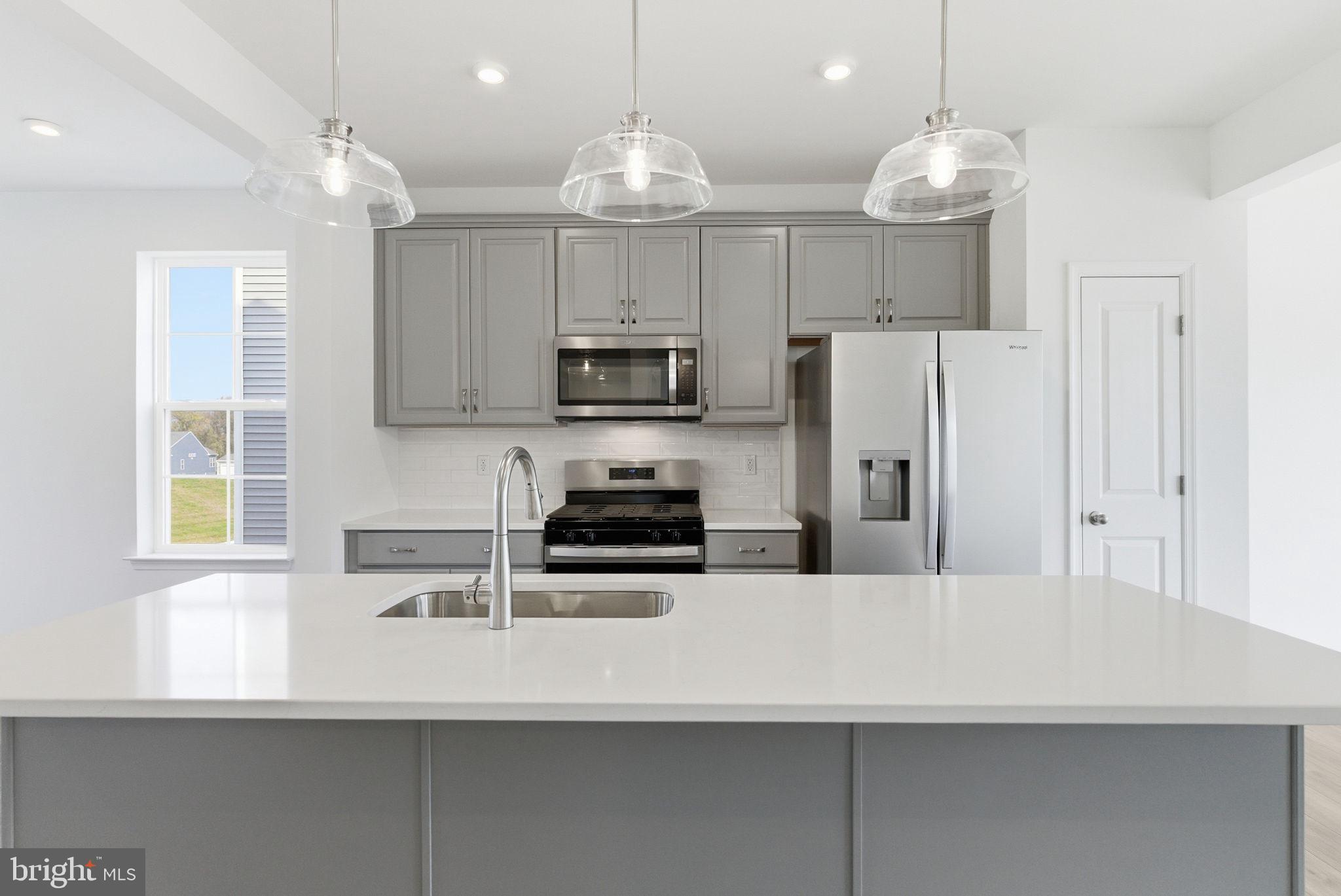 The only community within historic Charles Town with resort style amenities! **COVER YOUR CLOSING COST UP TO $10,000, Paid By DRB Homes and Lender Credit for Primary Residence with Use of Approved Lender and Title**See Sales Consultant for More Details
Welcome home to the Deep Creek II model in the desirable Huntfield community of Charles Town. This well-appointed 3-level townhome offers over 2,000 square feet of finished living space with 3 bedrooms, 3.5 baths, and a 1-car garage. The main level features an open floor plan ideal for everyday living and entertaining, with a spacious living room, large kitchen with center island, ample cabinet space, and adjoining dining area. A convenient powder room completes the main level. Upstairs, the primary suite offers a walk-in closet and private ensuite bath with dual vanities. Two additional bedrooms, a full hall bath, and upper-level laundry provide added convenience. The finished lower level offers flexible space along with an additional bath and access to the garage. Enjoy all that Huntfield has to offer, including sidewalks, green space, and a convenient location close to shopping, dining, schools, and commuter routes including Route 9, Route 340, and MARC train access. Just minutes to historic downtown Charles Town, Harpers Ferry, and a short drive to Northern Virginia and Maryland.  **Photos may not be of actual home. Photos may be of similar home/floorplan if home is under construction or if this is a base price listing.