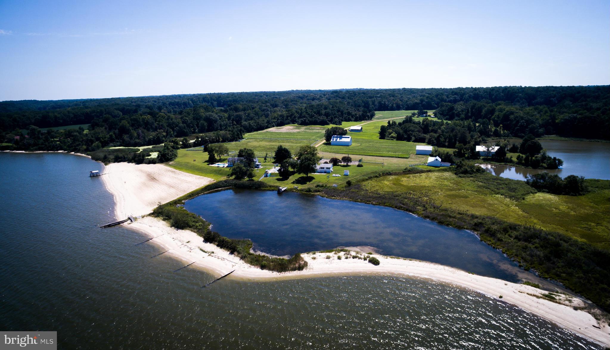 158 ACRES OF PASTURES, ROLLING HILLS, LAGOONS & FAR-REACHING LAWNS SURROUND AN HISTORIC PLAN-TATION HOUSE, 2-LEVEL GUEST HOUSE, CARE-TAKER'S HOUSE, BARNS, STABLES, OUTBUILDINGS, 2 IN-GROUND POOLS, TENNIS COURT, BOAT HOUSE, ART STUDIO & MORE. FLOWING WHITE SANDS STRETCH ACROSS THE MANICURED BEACH. THE DRIVE THROUGH SNOW HILL FARM IS A RETREAT FROM THE USUAL...A MAGICAL PLACE! SEE INFO IN DOCUMENTS.