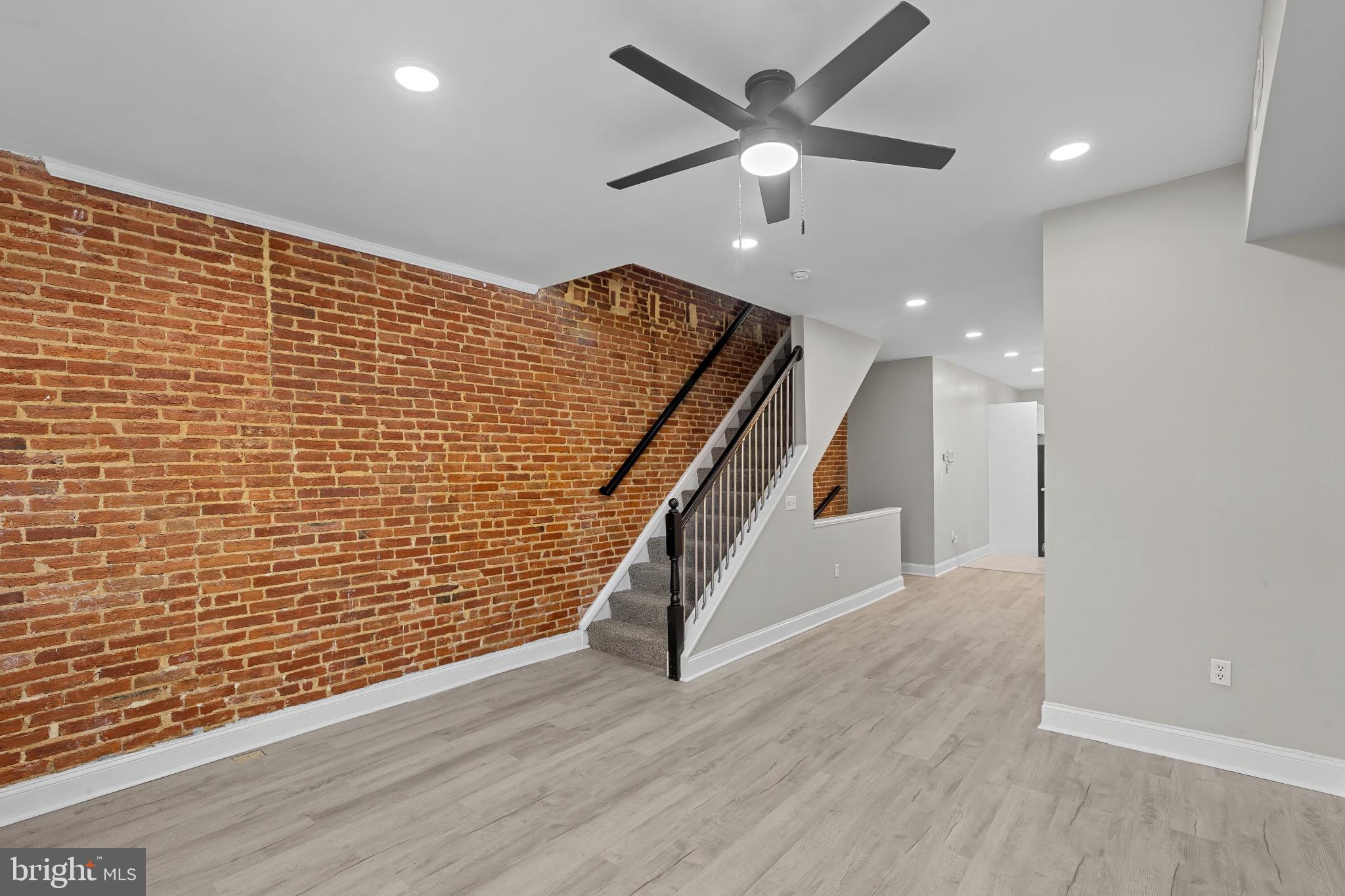 Welcome to the heart of historic Hollins Market—where classic Baltimore charm meets modern living. This beautifully renovated three-story townhouse offers the perfect blend of style, space, and functionality.

Step inside to discover a thoughtfully updated interior featuring an open and inviting layout, ideal for both everyday living and entertaining. The home is filled with natural light throughout, enhancing the warm finishes and contemporary touches.

Upstairs, the expansive top-level primary suite is a true retreat—bright, airy, and generously sized, offering the perfect space to unwind. Each level provides comfortable living with well-appointed bedrooms and updated baths.

Out back, you’ll find a rare, oversized fenced yard—an entertainer’s dream. Whether hosting gatherings, enjoying outdoor dining, or creating your own private oasis, this space offers endless possibilities.

Located in the vibrant Hollins Market neighborhood, just minutes from downtown, stadiums, and major commuter routes, this home delivers the best of city living with room to breathe.