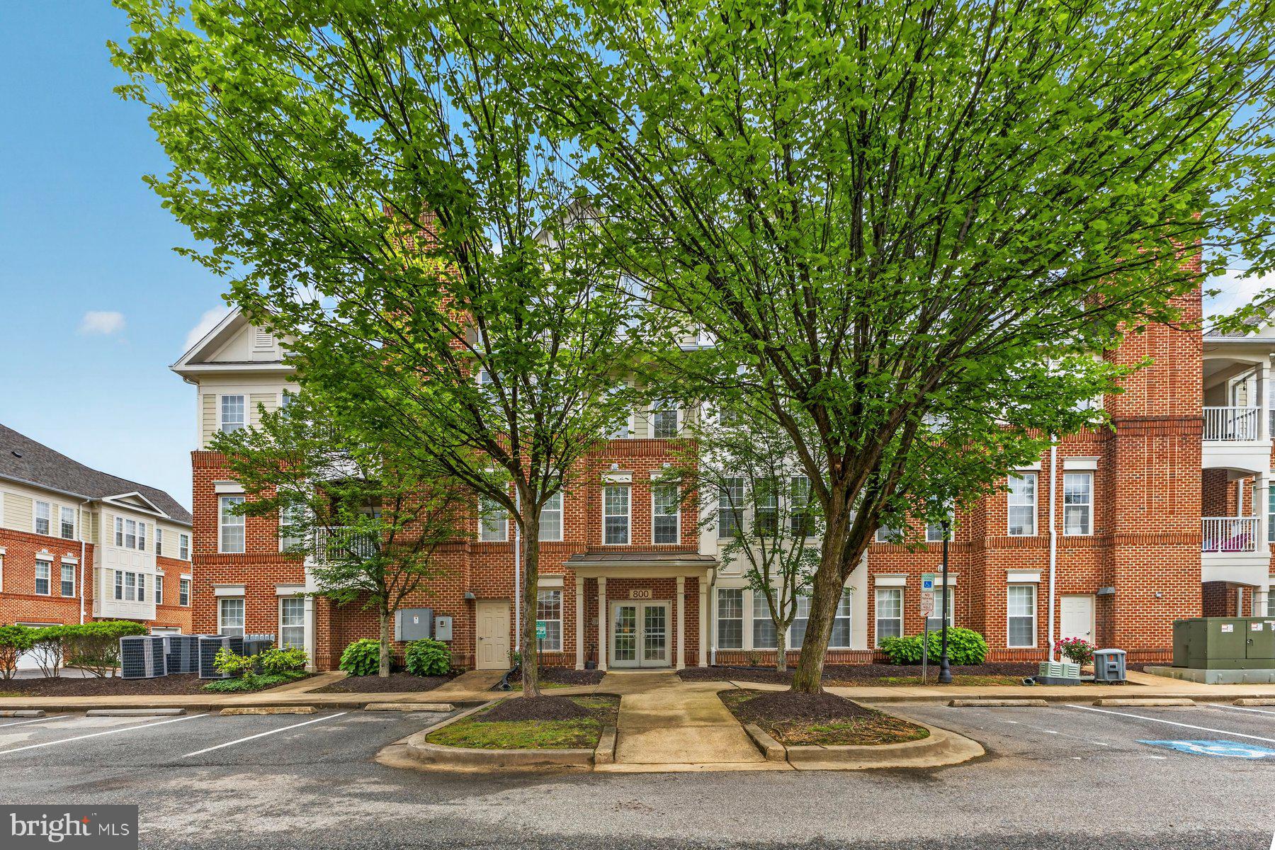 Welcome Home to the desirable Edelen Station Community in the heart of downtown La Plata! This stunning meticulously maintained condo offers a lovely open-concept floor plan filled with natural light the oversized windows throughout. Features granite countertops, stainless steel appliances, an inviting family room with an electric fireplace and built-ins, adjoined by a light filled wall of oversized windows that can be used as a light filled office space or a mini sunroom area that is designed for comfortable everyday living and entertaining. Impressive warm and inviting wood flooring and neutral ceramic tile flooring throughout. Enjoy the convenience of low-maintenance condo living with a rare bonus of an attached garage (perfect for parking or storage), with built-in shelving.  Also included are an additional parking space, a storage room, access to community amenities including the pool, the pet-friendly play area, the clubhouse with a fitness center and walking paths. Condo fees include water/sewer fees, trash/recycle fees, roof maintenance, snow removal, landscaping, grass cutting, pool maintenance.  Walking distance away from shopping, restaurants, local events, and other downtown amenities.  A wonderful opportunity to enjoy stylish maintenance free living in a convenient location with easy access to major commuting routes.
