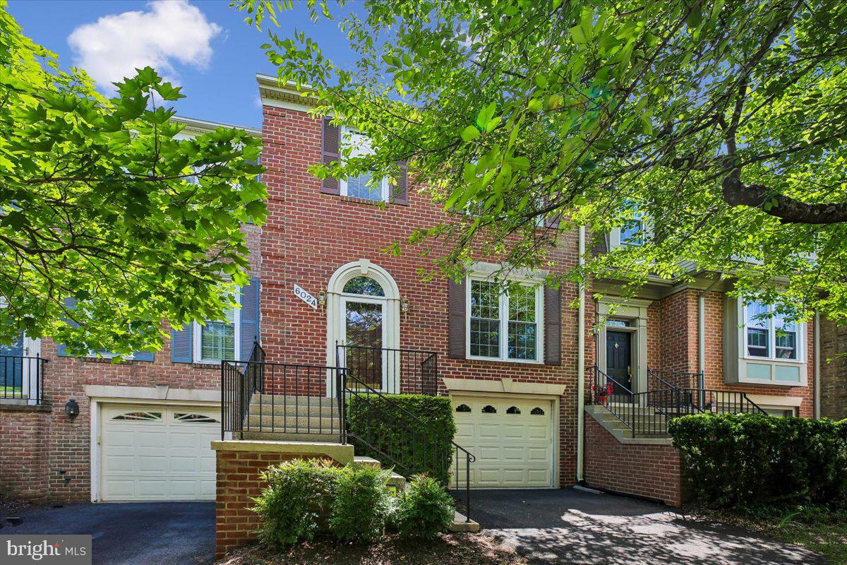 Welcome home to this stunning 3 bedroom, 2 full bath, 2 half bath brick townhome with one-car garage, minutes from White Flint & Grosvenor-Strathmore Metros, Pike & Rose, Strathmore Hall and all that both Bethesda and Rockville have to offer. Boasting extraordinary spaces throughout, this beautifully crafted townhome is full of luxurious features and situated on a quiet, tree-lined cul-de-sac close to expansive green spaces, sports courts, people and pet parks, trails, and shopping. This lovely home is updated, turn-key, ready to move into and sure to please!

FEATURES & AMENITIES 
3 bedrooms, 2 full baths and 2 half baths, 1-car garage
Stunning vaulted ceiling ceramic tile foyer entrance with expansive double door closet and a bright transom over the six-panel door to welcome you home!
Updated powder room, one of four bathrooms, with ceramic floor and trendy vanity and sink — sure to welcome guests and make them feel at home
Step up to the sun-filled main level living room, which features gleaming hardwood floor and oversized floor-to- ceiling windows with built in surround sound system and french doors to the brand new Trex deck
Dining room with hardwood floor with service to the kitchen provides for easy entertaining
Expansive remodeled kitchen features an eat-in breakfast area with ceramic tile flooring, Silestone countertops, attractive solid-wood oak cabinets, a gas range oven with a built-in microwave, and floor-to-ceiling windows
Extraordinary upper level owner’s suite boasts a dramatic vaulted ceiling, solid hardwood floor, expansive shelving for books and decor, and floor-to ceiling windows with view of the trees; includes a luxurious en-suite garden bath with Corian vanity counter, jetted tub and stand-alone glass shower with adjacent professionally designed walk-in closet
Two spacious upper level bedrooms with solid hardwood flooring and spacious closets; full ceramic hall tub bath; hall linen closet
Lower Level recreation room is perfect for relaxing in front of the slate hearth gas fireplace, setting up a media room for entertaining, or gaming with built in shelving; tall ceilings and French doors to the rear slate patio; floor-to-ceiling windows make this space expansive and bright; the rear yard is fenced with a back gate to green space
Laundry with top-of-the line front loading washer and dryer with access to extra under stairs storage room provide for spacious rooms on the lower level with access to the one-car garage
Just some of the special features include the garage with remote, brick exterior, a new Trex deck, a spectacular owner’s suite, replacement windows, newer systems, updated kitchen and baths, designer lighting, six panel doors and solid hardwood flooring throughout — so beautifully and meticulously maintained and improved over the years! The community is superb, a commuter's delight, boasting green spaces, accessibility for all with sidewalks throughout to explore and enjoy! 

Improvements:
2008- New roof installed and New hot water heater installed; 2010 - New insulation added in the attic; 2011 - New 6' gutters installed; 2020 - Garage door replaced; 2022 - New HVAC systems installed; 2025 - Driveway resurfaced; 2026 - New Trex deck installed