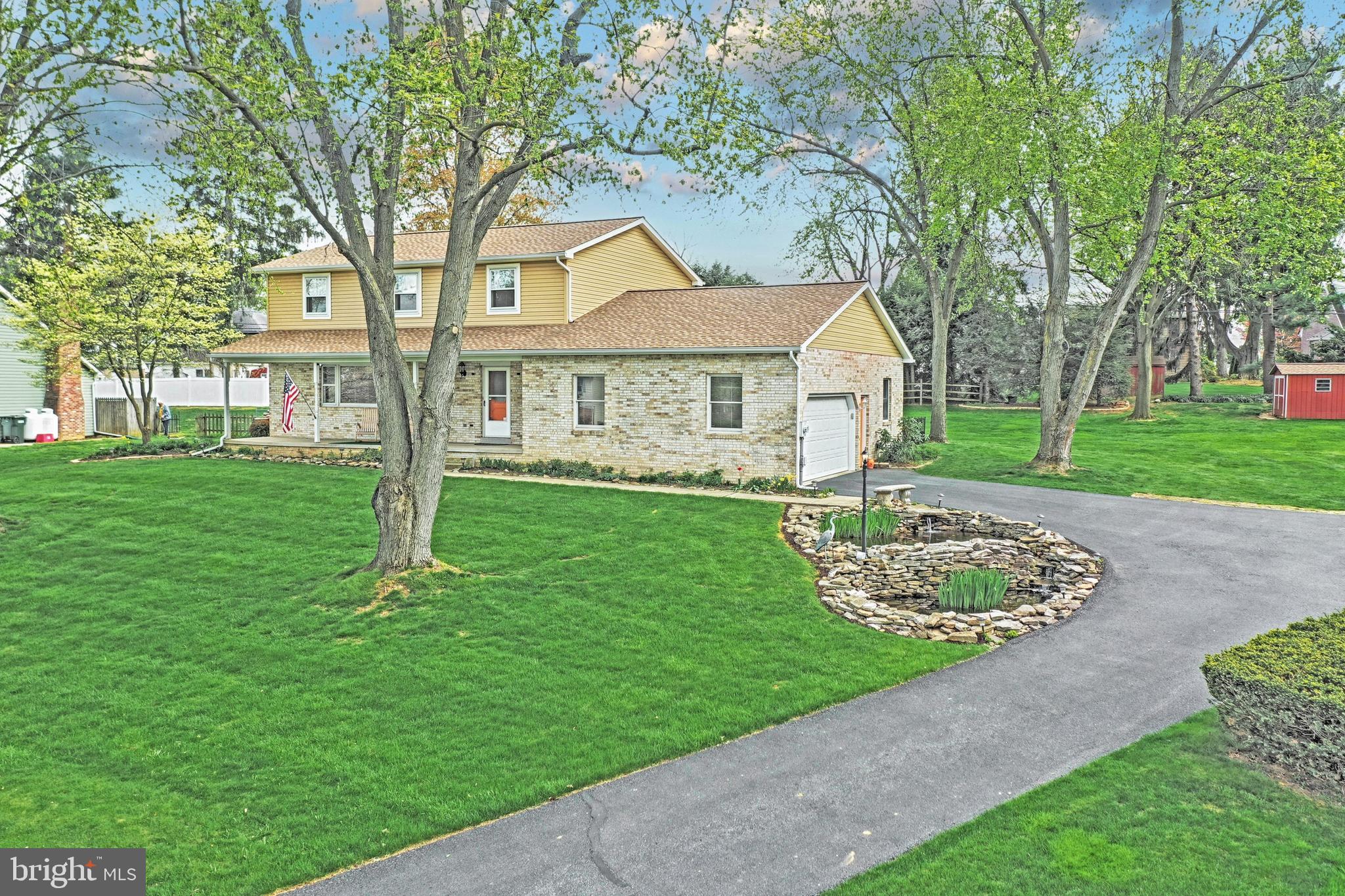 This beautiful 2-story is located in a quiet neighborhood in the heart of Manheim twp. Meticulously maintained and updated throughout. Your guests will love the Koi pond welcoming them at the entrance to the driveway. Entertaining is easy in this open floor plan. The updated kitchen with Corian countertops are open to the dining area and family room with a gas fireplace, and adjacent to the four season room. The second floor features a master suite, large bedrooms and loads of closet space, with a newly remodeled baths. Extra space finished in the lower level with a gas fireplace. Roof and siding only 2 years old, and 2 storage sheds are included. Located close to schools , shopping, and major highways.