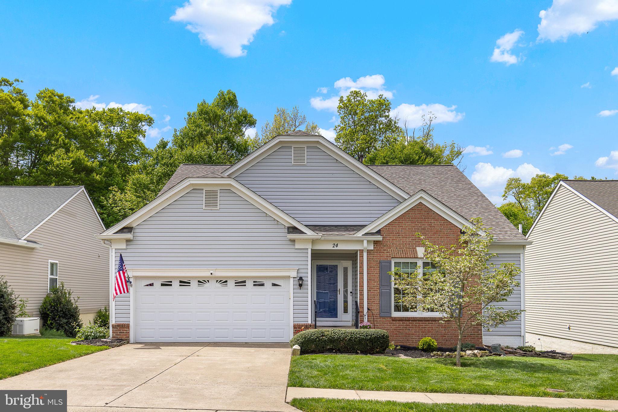 Welcome to this beautiful, well-maintained, move-in ready home nestled in the vibrant active adult community of Falls Run!  The sought-after Chesapeake model is one of the largest in the neighborhood, offering over 3,000 square feet of living space with 3 bedrooms, 3 full baths and a 2 car garage. The main level features a light-filled open layout with elegant flow—starting with a spacious dining room that leads into a cozy family room with gas fireplace, perfect for quiet evenings or hosting friends. You'll love the sunny breakfast nook and the gourmet kitchen, complete with combo microwave/double oven, cooktop with range hood, fridge with french doors, dishwasher, pantry, and plenty of counter space. The primary suite offers a peaceful retreat with an updated bathroom featuring a tiled shower and luxurious hydro-therapy walk-in tub. A library, 2nd bedroom, and an additional full bath complete the main floor. Downstairs, the finished basement is an entertainer’s dream—featuring a large rec room, 3rd bedroom, full bath, and an amazing bar with built-in cabinetry, mini-fridge, and included barstools! You'll also find a craft room, workshop, and tons of storage — plus a stair-lift for easy access between levels. Enjoy peaceful wooded views from your low-maintenance deck with a retractable remote-controlled Sunsetter awning, or from the sun-drenched lower-level sunroom that walks out to the backyard. Key updates in the past 10 years include roof (2021), HVAC system (regularly serviced), windows, kitchen appliances, and water heater. There's also an active radon mitigation system for added peace of mind. Falls Run is a security gated 55+ community packed with first-class amenities: indoor & outdoor pools, clubhouse with fitness center, tennis & pickleball courts, walking trails, and a full calendar of events and activities. Don’t miss this rare opportunity to enjoy space, style, and serenity in one of the area’s premier active adult communities!