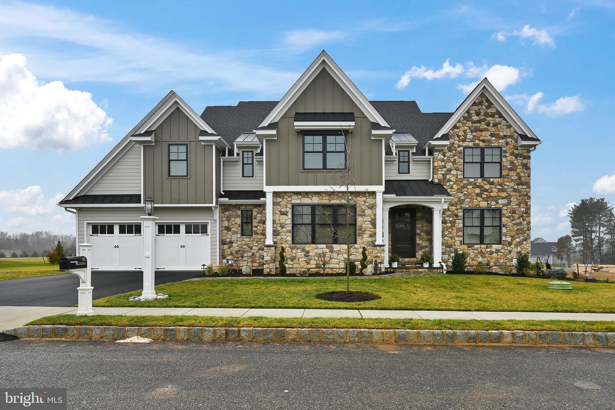 A rare opportunity awaits in the award-winning community of Troutbeck Farm, Malvern's finest neighborhood by local and semi-custom builder Moser Homes, without the wait for a new build. With a team consisting of renowned architect McIntyre Capron designing the floor plan, Moser Homes constructing a quality home with unmatched luxury combined with the Seller's keen eye for timeless finishes, you can buy with confidence. Located within the highly-acclaimed Great Valley SD in bucolic Willistown, you are just minutes from downtown Malvern Borough. Combined with refined living in a community oriented setting with open space and walking trails, you will easily fall in love with this location. Currently, there is an (approx) 1 year wait for a new build in Troutbeck; trade in the wait time for a turn-key home & begin unpacking in the Spring! At just 1-Year Young, this 4BR, 3 Full/2 Half Bath "Warren" Model w/ Finished Basement and an abundance of additional upgrades completed by the owner (see document section for a detailed list of all features by Moser as well as post-settlement improvements) includes a Chef's Kitchen with 11x4' quartz island, a Mud Room with Closets and "Cubbies", Main Floor Office, Main Bedroom Suite complete with Two Custom WIC and an Ensuite Bathroom, a spacious 2nd floor Laundry Room - all on a premium corner lot with a 2-car garage with custom organization system. This home is the perfect marriage of elegance and comfort, boasting 10' ceilings on the main floor and in the basement, a 2-story foyer with stunning chandelier and floor to ceiling trim and millwork that carries your eye up the beautiful turned stairwell tower. Easy to maintain engineered wood plank flooring flows throughout the first level, as does detailed woodwork, two-piece crown molding and recessed lighting. The formal LR offers a quiet space in the corner of the home to sit & relax. The formal DR offers beautiful wall wainscot, large windows, a tasteful gold chandelier & a convenient entry to the kitchen through the adjacent Butler's pantry. The 24x20 family room is the heart of the home, featuring a gas double-sided fireplace with a mantle and custom built-ins, creating a cozy and inviting atmosphere. The kitchen, the sunny "morning" room for informal dining, and the family room flow together nicely for everyday living and entertaining guests. The kitchen has been upgraded extensively to feature a top of the line appliance package (Wolf wall oven, microwave & 6-burner gas cooktop, Cove DW, Thermador Ref. & U-Line Beverage Cooler Drawers), 42" cabinetry with additional glass front cabinets with accent lighting, and a box ceiling with shiplap detail. There is a 16x12 office on this level- work next to the warmth of a fire or open the blinds & walk outside sliding doors to your sun-drenched deck to recharge. An additional hall WIC with added electrical outlet completes this 2,170sf level. As you walk up the stairs, the millwork, light fixtures and the 13x-11 loft-style landing that overlooks the foyer at the top of the steps will take your breath away. Double solid wood doors lead to the master suite of your dreams w/an ensuite bath feels more like a spa, w/spacious vanity top w/ dual sinks + seating. There is a linen closet & water closet & shower w/rainfall shower head, bench seat, herringbone tiled niche, & a tiled area outside of the shower that is the perfect space for a bench to dry off. The dual WICs both are outfitted with custom organization systems for ALL of your clothing & shoes. Two bedrooms, both with shiplap accent walls & large closets share a Jack & Jill bathroom. The 4th BR has an ensuite bathroom AND a WIC. The basement is an entertainer's dream with a 2-tiered bar, large gathering area, a "movie corner" w/ built-in wall speakers, powder rm and storage rm. An Azek deck extends the living space. This home is a true must-see. NOTE:Seller did 500k+ upgrades with Moser and approx. 125k in post-settlement improvements.